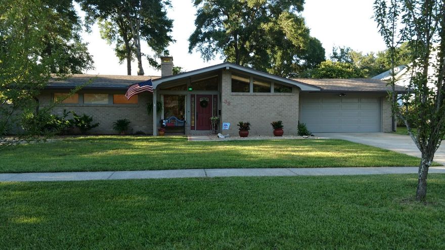 This wonderful home shows the care of the owners throughout. Lots of curb appeal to start. The high-ceiling foyer features crown molding and chair rail. This area is bright thanks to the tall window. To the right is the dining room which with the help of multiple windows is flooded with natural light. The living room/Study is to the left from the foyer. This room is also bright thanks to windows and doors. This door leads to a private walled courtyard. A fireplace with built-in book shelves adjacent offers a nice reading or relaxing spot. Crown molding flows in this home and shows the owners attention to decorative details. The family room, breakfast bar and kitchen are open to each other. There are french doors that open from this area onto a spacious Satillo-Tiled patio. The patio afford