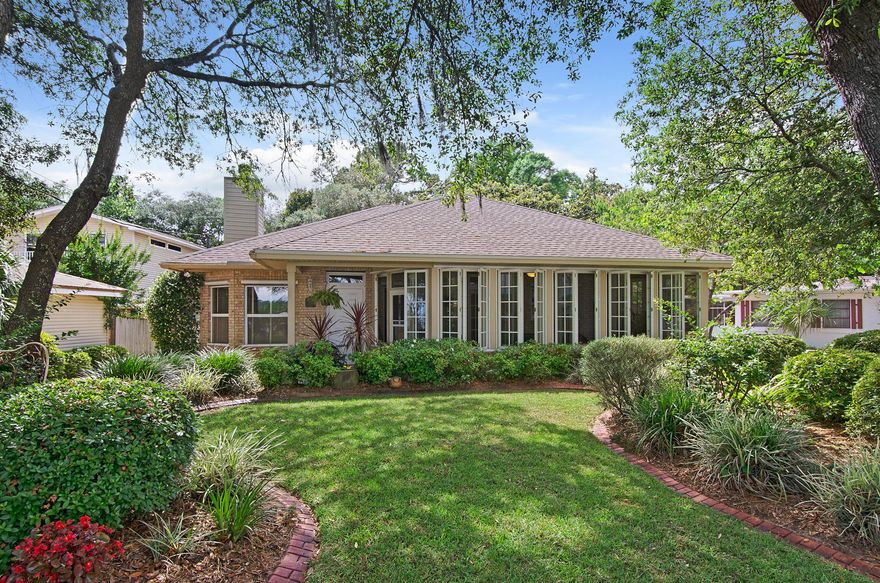 Enchanting. Distinctive. Far-reaching Water views over Boggy Bayou to Destin. Quality space, privacy and wonderful design flow begin in the large open kitchen with solid wood custom built cherry cabinetry, stainless appliances, gas range and one-of a kind artistic island. The family/living room is adorned with custom built in book cases for the display of your worldly travels and/or book collection accented by the gas burning fireplace. Every space was carefully designed in this 3 bedroom home: Engineered hardwood throughout, tile in the bathrooms and carpet in master bedroom. Nine foot ceilings throughout, extra-wide doors, all brick exterior, NEW roof (2015) with 30-year warranty (10-year on workmanship) and one of a kind security system directly connected to Valparaiso police, fire an
