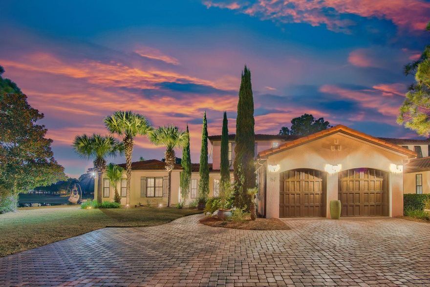 Elegant and private, this coastal lakefront home primely situated on an expansive lot at the end of a cul de sac features bright living areas, a tranquil outdoor oasis, and golf course views. High ceilings, travertine flooring, a soft palette, and an open floor plan make this home feel spacious and serene. Perfect for entertaining, highlights include a gourmet kitchen, island with breakfast bar, three dining areas, and wine cellar. Multiple sets of French doors open to a true backyard oasis allowing for seamless indoor/outdoor living. Enjoy pristine views of the lake and golf course, sizable private saltwater pool, two covered exterior living areas, two exterior fireplaces, and an outdoor kitchen with bar and grilling area. The expansive homesite provides plenty of privacy, spectacular