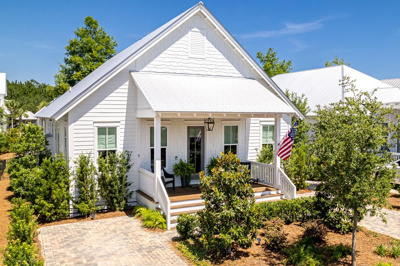 Nestled in the gated Cypress Dunes community on 30A's peaceful west end, this thoughtfully designed 3 BR/2.5BA single level home is perfectly suited as a full-time residence, second home or as a rental property. No detail has been overlooked with standout finishes including brushed oak hardwood floors, custom barn doors, 10 feet ceilings, custom cabinetry and designer lighting.  The welcoming and open living area offers plenty of room for entertaining with two sofas and dining table that comfortably seats 6.  The fully equipped kitchen offers commercial grade stainless appliances including a gas range and wine refrigerator.  Two large porches, one screened, provide ample room to enjoy the warm Gulf breeze.  Never rented, additional highlights of this one-owner home are