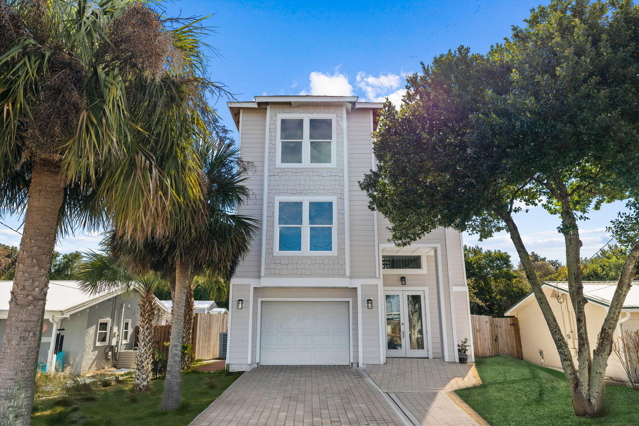 Seize the chance to own this charming three-story beach house, perfectly situated in the heart of Panama City Beach on the sought-after West End near 30A. With NO HOA fees and short-term rental potential, this home is a rare find.  It has undergone a complete interior remodel, along with significant updates to major systems and features, including:  Two brand-new HVAC units, A newly permitted roof, Fresh interior and exterior paint, Privacy fence installation, new pavers, New Deck, New Kitchen, and bathrooms.  Additional Functional features that you and your guest will love:  First-floor master suite, Two laundry rooms (on the 1st and 3rd floors), adding convenience for multi-level living, Three balconies, one on each floor, offering stunning views and outdoor relaxation, Breathtaking ocean views from the 3rd-floor balcony off the true master suite.  This property offers a perfect combination of amenities, location, and value. This home has incredible potential as a primary residence, vacation home, or lucrative investment property.  