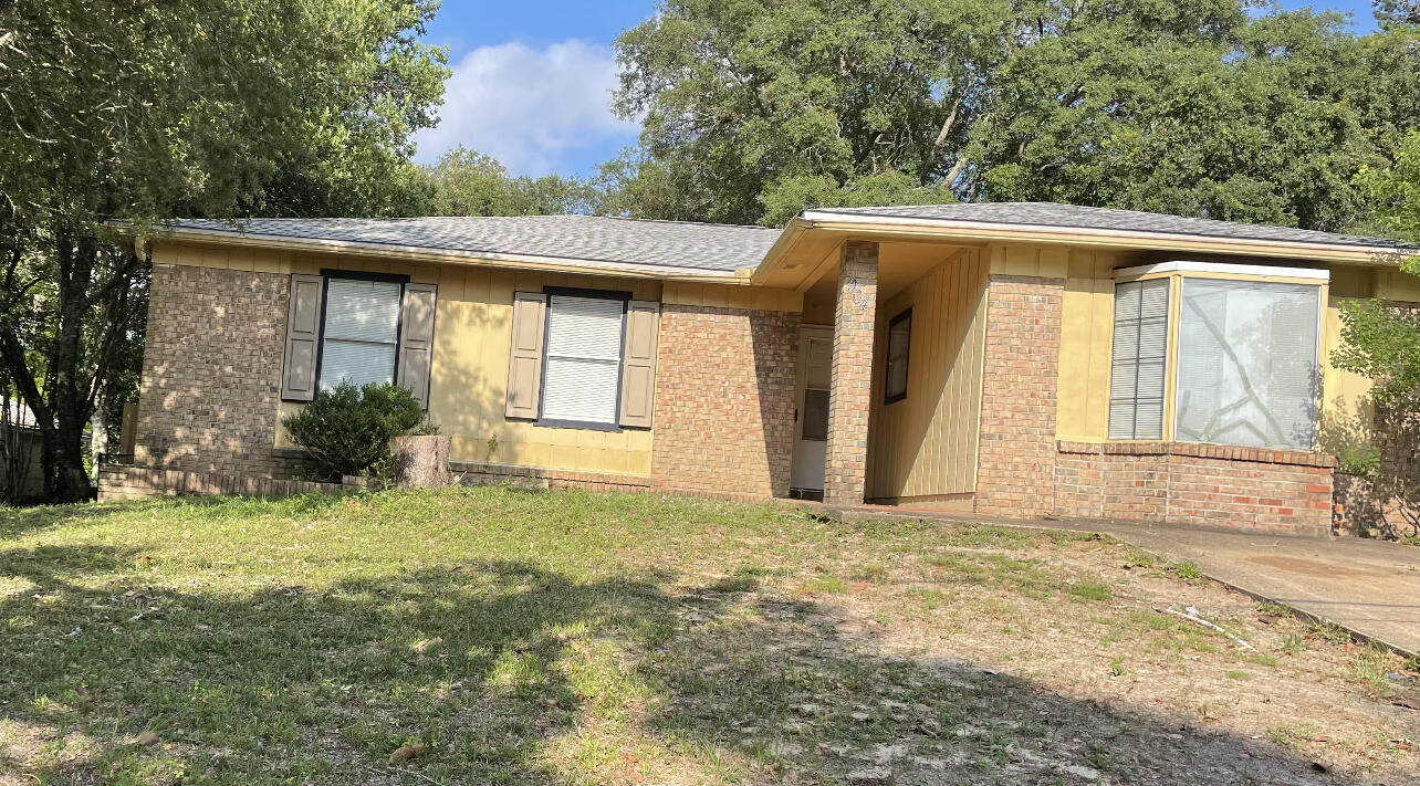 This 3 bedroom 2 bath (with converted garage) home is waiting for you. Close to the high school. Newly painted and new flooring adds to the charm of this ranch style home. As you enter the home you will notice a very large living area with plenty of room for oversized furniture. Kitchen has plenty of cabinets, a pantry for storage, and a pass through window for you convenience. You will find a handy breakfast nook attached to the kitchen. Screened in back porch for entertaining your family or friends.