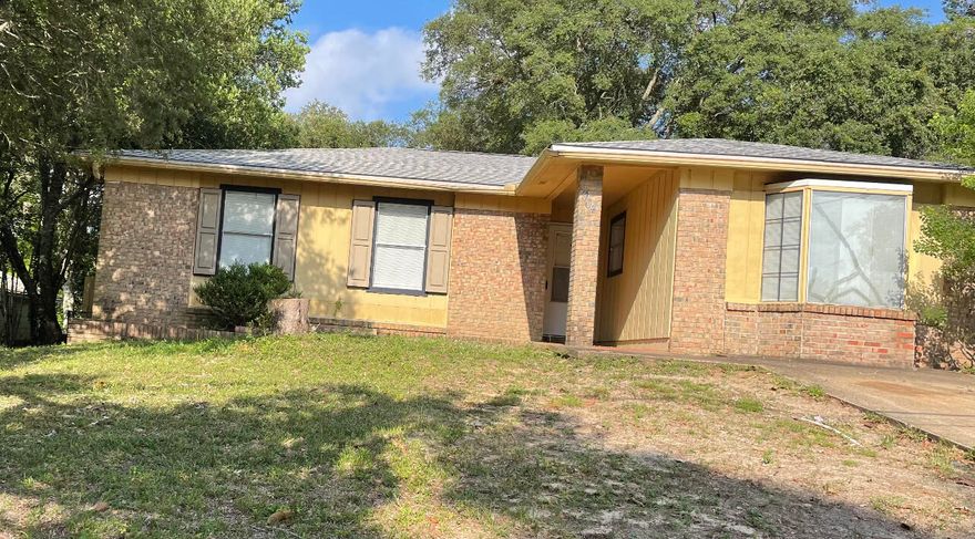 This 3 bedroom  2 bath (with converted garage) home is waiting for you.  Close to the high school. Newly painted and new flooring adds to the charm of this ranch style home.  As you enter the home you will notice a very large living area with plenty of room for oversized furniture.  Kitchen has plenty of cabinets, a pantry for storage, and a pass through window for you convenience.  You will find a handy breakfast nook attached to the kitchen. Screened in back porch for entertaining your family or friends.