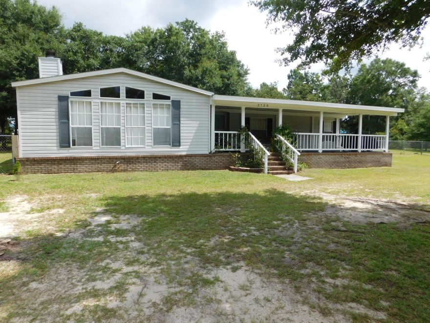 This spacious home waiting for you on 1.1 acre lot.  Featuring 1,919 sq, ft, with 3 bedrooms, 2 baths split bedroom plan, family room with fireplace,  living room and dining area.   Kitchen with stainless appliances, walk in pantry, stainless refrigerator and garbage disposal.   Large laundry room with sink, storage cabinets and washer and dryer to stay.  Master bedroom split floor plan features master bath garden tub, double vanities and walk in shower.  Front covered porch 36x13 and back 26x16.  Lot features various fruit trees (plum, pear, pomegranate, fig, blueberries, cherry, grapefruit) and many large shade trees.  There is an area fenced in backyard that could be used for pets or gardening.  RV canopy as well for boat or RV.  Storage building with power.  New roof 2021.