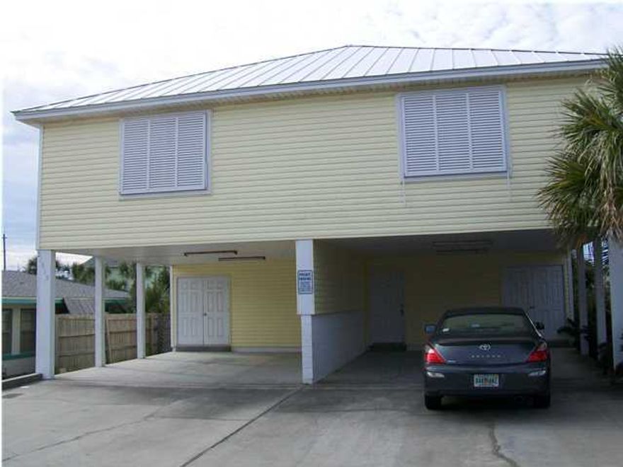 This unfurnished two bedroom, two bathroom duplex is located just minutes away from the beach. You can even catch a glimpse of the ocean from the back porch of this two story rental home in Panama City Beach. You'll enjoy the features of this home including tile in the main living areas and carpet in the bedrooms. The first floor boasts one bedroom and one bathrooms with the remaining bedroom and bathroom located upstairs. Pets are negotiable. There is covered parking for two cars. Washer and dryer included. There is no access to the pool that is connected to the property behind this duplex. You do not have access to the back stairs.