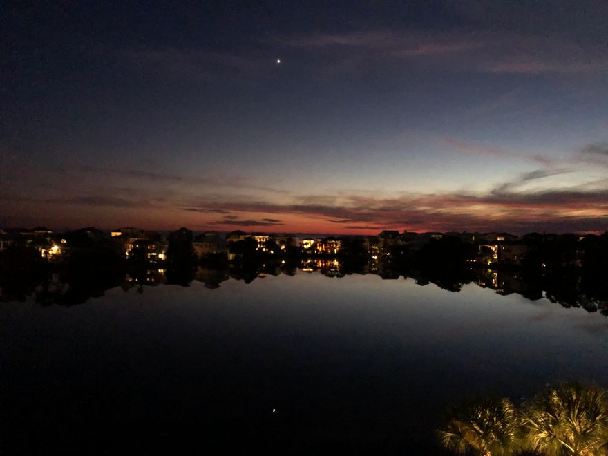 Welcome to Carillon Beach, one of the Emerald Coast's most private and sought-after gated communities. This exceptional 4th-floor lakefront condo offers the rare combination of tranquil lake views and beautiful Gulf views, a privilege enjoyed by only the 4th- and 5th-floor residences. Recently renovated and offered fully turnkey, this elegant 1-bedroom, 1-bath retreat is ideal as a refined personal beach escape or high-demand investment property.Inside, the bright open-concept living and kitchen space is perfectly positioned to capture the peaceful beauty of Lake Carillon, creating a truly scenic coastal setting. A rare and thoughtful design feature -- a door separating the bedroom from the main living area -- adds both privacy and practicality. Stylish furnishings, tasteful decor, and an HVAC system just two years old complete this beautifully updated residence, ready for immediate enjoyment.