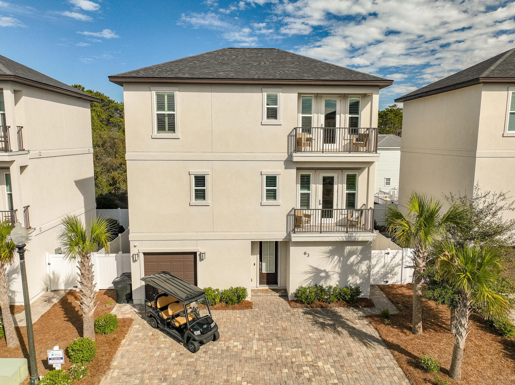 Welcome to 63 Ciboney Street, a stunning beach retreat nestled in the heart of Miramar Beach. Built in 2019 by long time local builder Boswell Builders, and being sold fully-furnished, this chic 4 bedroom, 4.5 bath home offers the perfect blend of modern design and coastal charm. With a 3-story layout, this home provides plenty of space for family and friends to gather, unwind, and enjoy the best of coastal living.Hop on the included 6-seater golf cart to enjoy the sugar-sand shores of the Gulf, less than a mile away. This home offers easy access to the beach, as well as a community pool for those days when you just want to lounge in the sun. The fully fenced backyard is an oasis of its own, featuring a spacious patio with beautiful pavers and plenty of seating, perfect for outdoor dining or simply relaxing after a long day by the water or shopping.
Stepping inside, the first floor features a guest bedroom with an ensuite bath, built-in hallway bunks ideal for additional guests, a convenient laundry room, and direct access to the backyard retreat. The second floor serves as the heart of the home, where an open-concept living area and kitchen create a warm and welcoming atmosphere. Coastal chic accents like plantation shutters, quartz countertops, and wood-grain tile flooring, which can be found throughout the home, elevate the space. While a half bath adds extra convenience. Also on this level is a private guest suite, complete with its own bath, walk-in closet, and a serene balcony escape to enjoy the fresh sea breeze.
On the third floor, another guest bedroom with a private ensuite bath provides even more room for visitors, along with a second laundry room for added ease. The primary suite is a true retreat, offering a private balcony, a walk-in closet with custom built-ins, and a luxurious bathroom featuring a walk-in shower with floor-to-ceiling subway tile walls.
The community of Hidden Palms offers a community pool with bathrooms, lounge chairs, and green space for lawn games.
Whether you're looking for a vacation home, an investment property, or your own piece of paradise, this exceptional Miramar Beach home is an opportunity you won't want to miss.
Being so centrally located in Miramar Beach, you are truly have it all. All within a 10 minute drive or less you have shopping, dining, and entertainment at the Destin Commons, Silver Sands Outlet, and Sandestin Resort. Well known beach destinations like Pompano Joes, Whale's Tail Beach Bar, and Seascape are all an easy golf cart or bike ride away.