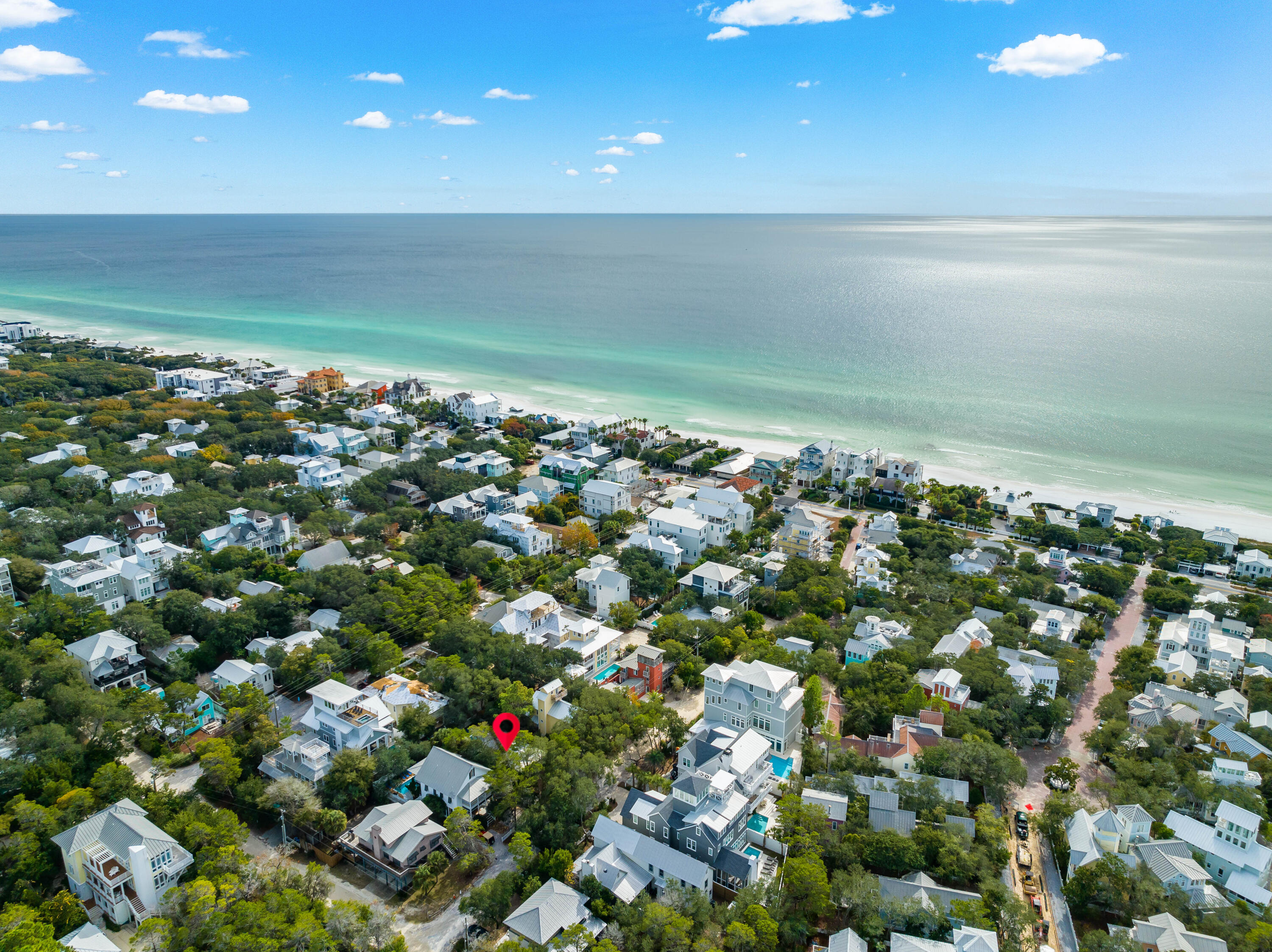 Nestled just one street east of Seaside, 25 Cypress Hill Road in Santa Rosa Beach, FL, is the quintessential Florida beach cottage. Its prime location ensures easy access to Seaside's vibrant community, including restaurants, shops, markets, events and more all within a couple minute walk. The property sits on a spacious 50x100 lot offering the opportunity to scrape the existing residence if you choose and start fresh. Privacy is a key feature, with mature trees surrounding the property, creating a serene retreat. The cottage boasts three bedrooms and two bathrooms, with an open-concept living space that seamlessly blends the kitchen, dining, and living areas. A cozy screened-in front porch enhances the charm and a large heated pool highlights the options for entertaining.