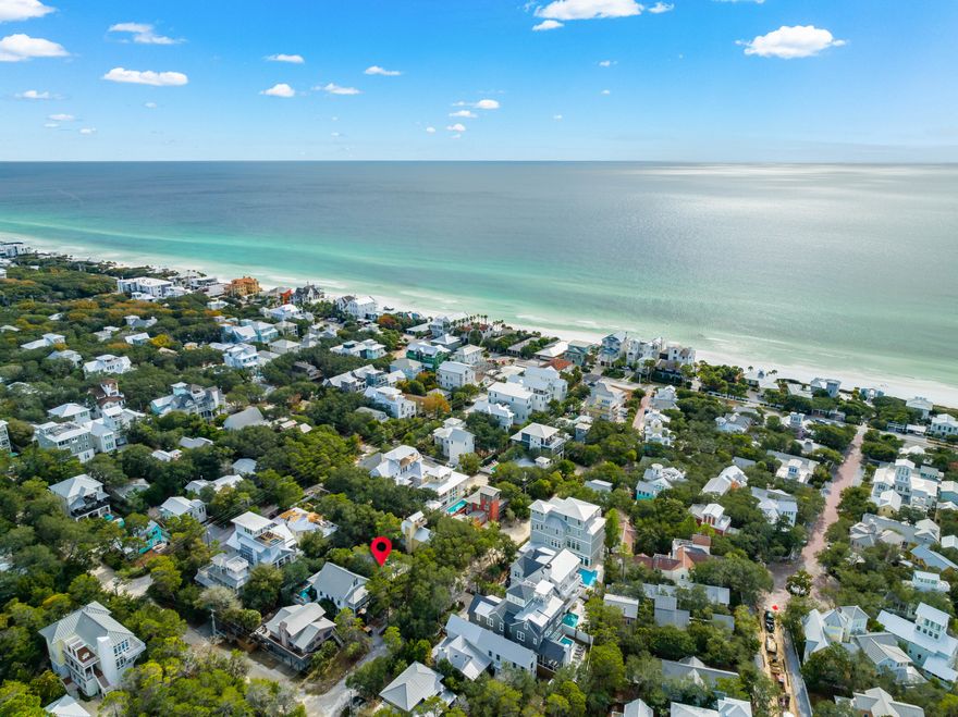 Nestled just one street east of Seaside, 25 Cypress Hill Road in Santa Rosa Beach, FL, is the quintessential Florida beach cottage. Its prime location ensures easy access to Seaside's vibrant community, including restaurants, shops, markets, events and more all within a couple minute walk. The property sits on a spacious 50x100 lot offering the opportunity to scrape the existing residence if you choose and start fresh.  Privacy is a key feature, with mature trees surrounding the property, creating a serene retreat. The cottage boasts three bedrooms and two bathrooms, with an open-concept living space that seamlessly blends the kitchen, dining, and living areas. A cozy screened-in front porch enhances the charm and a large heated pool highlights the options for entertaining.