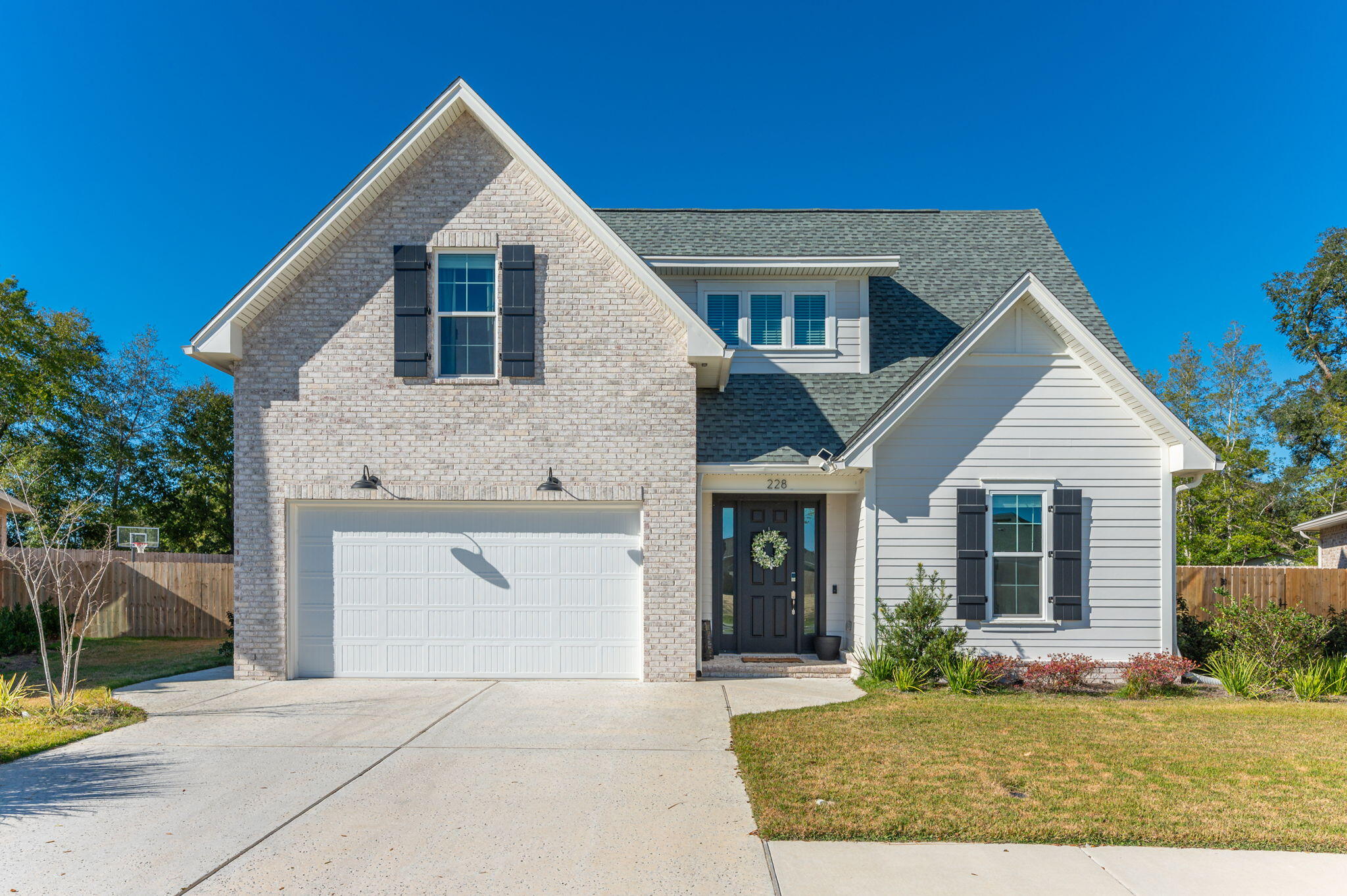 This stunning 4-bedroom home on 228 Abner Way combines modern design with thoughtful upgrades, making it the perfect retreat for your family. Located in the heart of Niceville, this home is just minutes from shopping, restaurants, and local amenities. It's even walkable to those Friday night games--Go Eagles! A short drive to Eglin AFB and the beautiful white beaches of Destin. This home offers the largest lot in the neighborhood and a wealth of features inside and out.Inside, you'll find:An open-concept floor plan ideal for everyday living and entertaining.A modern kitchen with upgrades like:An extended island with extra storage for added functionality.Soft-close drawers for a sleek, premium touch.Stainless steel appliances and ample counter space for all your culinary needs. Wi-Fi Refrigerator and Dishwasher 
CAT 5 Cable
Dual thermostat(one for each level)
A spacious primary suite featuring:
A walk-in shower with a built-in bench for comfort and convenience.
Large walk-in-closet with added shelving 
Upstairs, a private bedroom with its own en suite bathroom and a common space, perfect as a hangout area, media room, or play area.

Outside, you'll love:

A brand-new pool, completed in March 2023, with a tanning ledge and the ability to heat or cool, providing year-round relaxation.
The expansive backyard, offering endless possibilities for entertaining or creating your own oasis.
Finished garage 
A built-in security system, offering peace of mind for your family.

Buyer is responsible for verifying all data and information, including lot size and room measurements, as it is deemed reliable but not guaranteed.
Seller will be taking the TV mounts in the bedrooms.