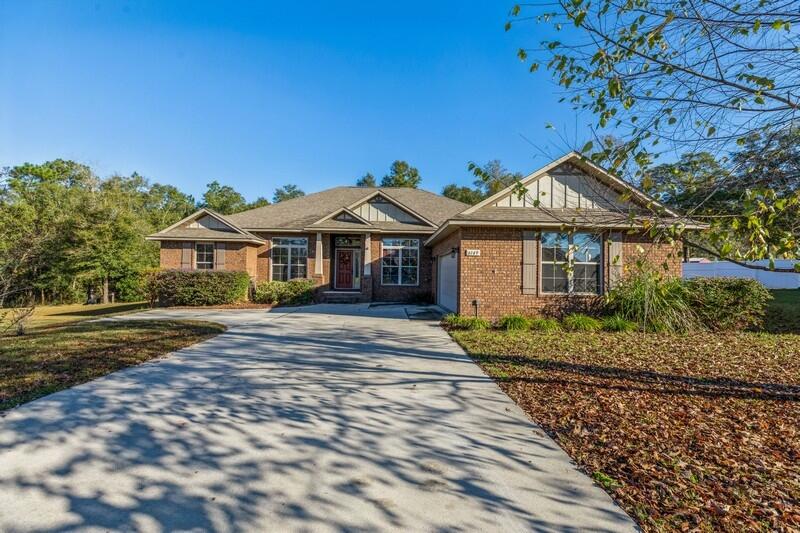Welcome home! This craftsman style 4-bedroom, 3-bathroom home sits on a large .62-acre lot in a cul-de-sac in one of the most sought-after subdivisions. This split floor plan has 2 bedrooms to the left of home with a mother-in-law suite in the back of home and the owner suite to the right of home with access to enclosed porch. Owner suite bathroom has 2 separate closets, double vanity, garden tub, and shower. This kitchen has all a buyers must have with granite counter tops, kitchen island, built in wine racks, double oven, stainless steel appliances (refrigerator not included), plenty of cabinet space with a custom built in shelve in the soffit space above the cabinets perfect for decorations and baskets. The kitchen also has a large closet pantry, breakfast bar and eat-in-kitchen area.