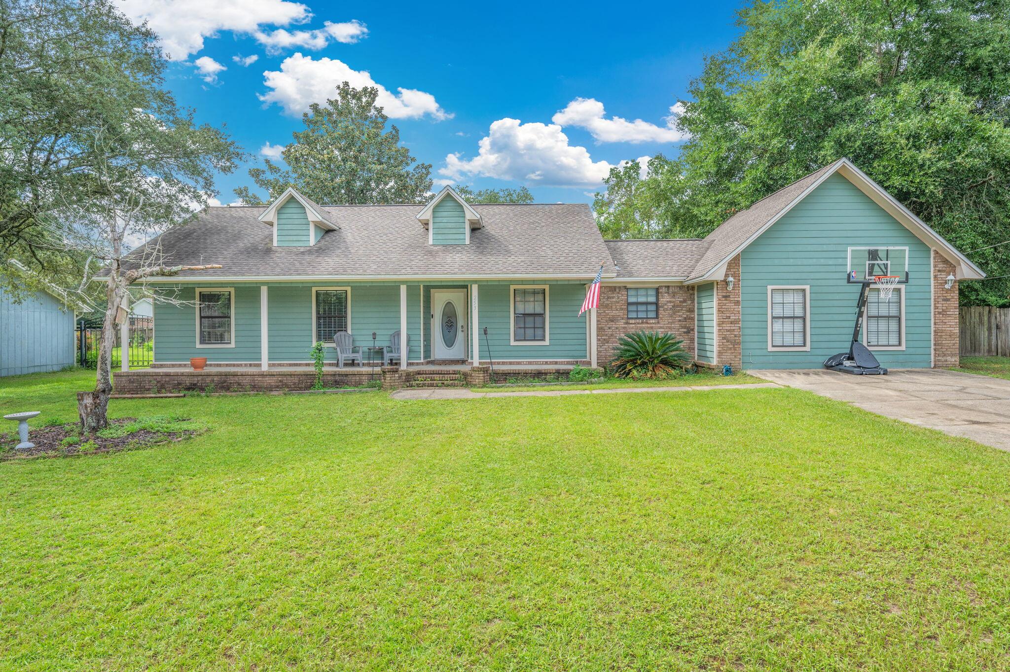 Spacious 3BR/2BA home with bonus room in Countryview Estates, South Crestview. Approx. 1,898 sq ft on a .33-acre fenced lot. Large 19.5' x 17.1' bonus room with closet ideal for office, playroom, media space, or bedroom. Living room features wood-laminate flooring, fireplace, and open flow to dining. Kitchen includes stainless steel appliances and tile in wet areas. Bedrooms and bonus room are carpeted for comfort. Energy-efficient solar panels help reduce utility costs. Oversized fenced backyard offers plenty of space for outdoor activities. Built in 1987, this single-story home combines convenience, functionality, and location near schools, shopping, and commuter routes.