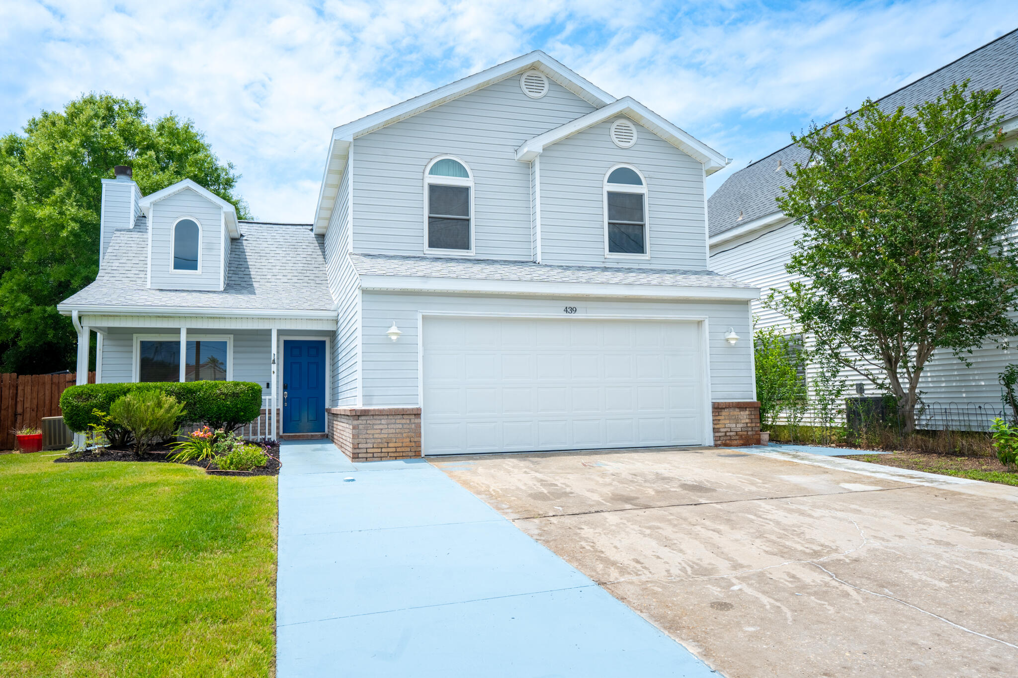 Located just minutes from the front gate of Hurlburt Air Force Base. Nestled on a quiet road with very limited traffic, this property offers both privacy and convenience. The extended driveway provides ample parking space--perfect for RVs, boats, or trailers. The attached garage (not pictured) features an epoxy-coated floor, extensive metal wall storage, and its own mini-split system for heating and cooling.Inside, the main home offers 3 bedrooms--all located upstairs--2 full bathrooms, and a convenient half bath downstairs for guests. The living room boasts tall ceilings and a cozy wood-burning fireplace. Enjoy a formal dining room as well. The spacious primary bedroom includes a beautiful water view of the sound from the window. To top it off, the home is equipped with solar panels.
