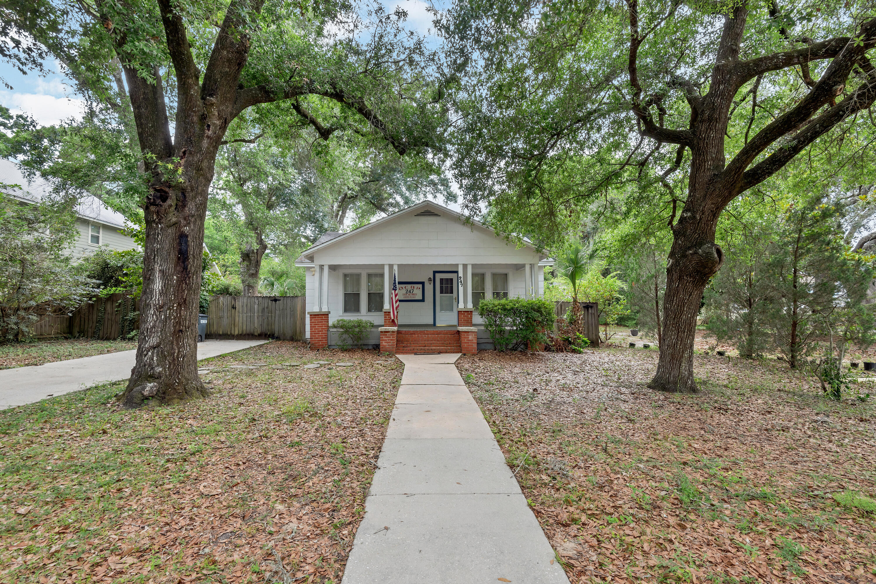 This is your opportunity to own a true Florida Cottage! This two-bedroom, one bath is boasting with charm and centrally located in Valparaiso. The dining and living space are separated by French doors to add to the character of this home. Tons of windows leave natural light throughout each room. This property features a spacious front porch, perfect for enjoying your morning coffee! The large backyard has tons of potential, with closed in sunroom/porch off the kitchen! Steps away from the Emerald Coast waters. The large kitchen features stainless steel appliances and window over the kitchen sink. Rare opportunity to own close to the water!