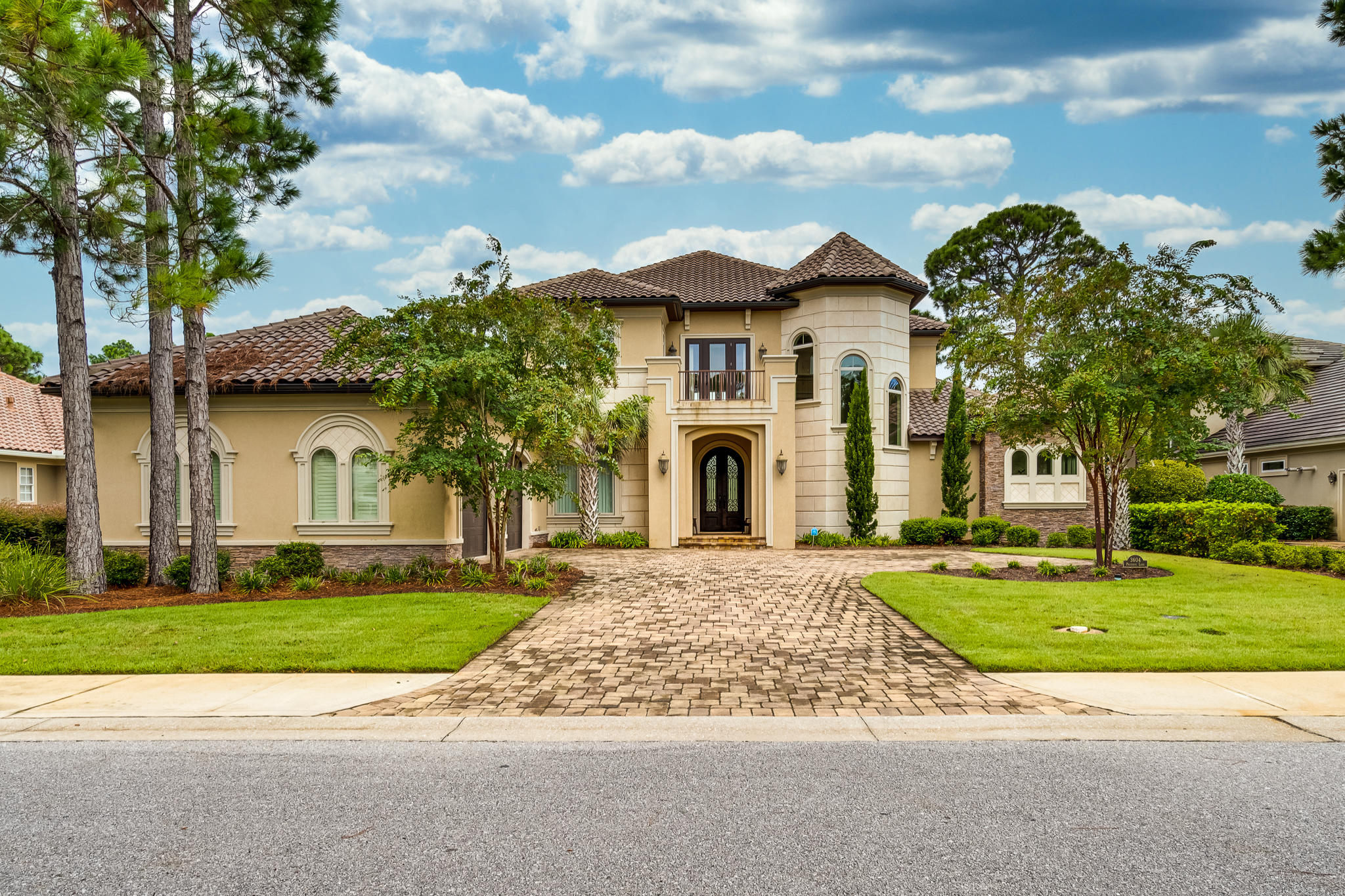This Elegant Custom Estate Home features 4 spacious bedrooms and 5 baths. A warm and inviting 2 story foyer greets you with views of the pool and golf course. The spectacular entrance is accented with soaring ceilings, formal living area, fireplace, and a wall of glass windows providing for tranquil pool and golf course views. The gourmet kitchen features custom cabinetry, quartzite and limestone countertops, top of the line appliances, kitchen island, tile backsplash, recessed lighting, and spacious walk in pantry. This well designed floor plan conveniently situates the Master Suite on the main level, offering privacy and generous square footage.