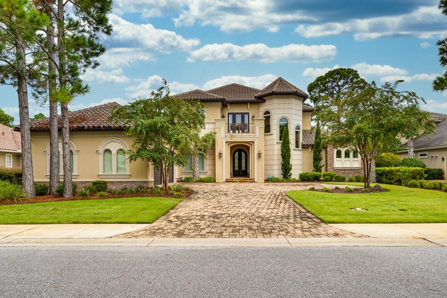 This Elegant Custom Estate Home features 4 spacious bedrooms and 5 baths. A warm and inviting 2 story foyer greets you with views of the pool and golf course. The spectacular entrance is accented with soaring ceilings, formal living area, fireplace, and a wall of glass windows providing for tranquil pool and golf course views. The gourmet kitchen features custom cabinetry, quartzite and limestone countertops, top of the line appliances, kitchen island, tile backsplash, recessed lighting, and spacious walk in pantry. This well designed floor plan conveniently situates the Master Suite on the main level, offering privacy and generous square footage.