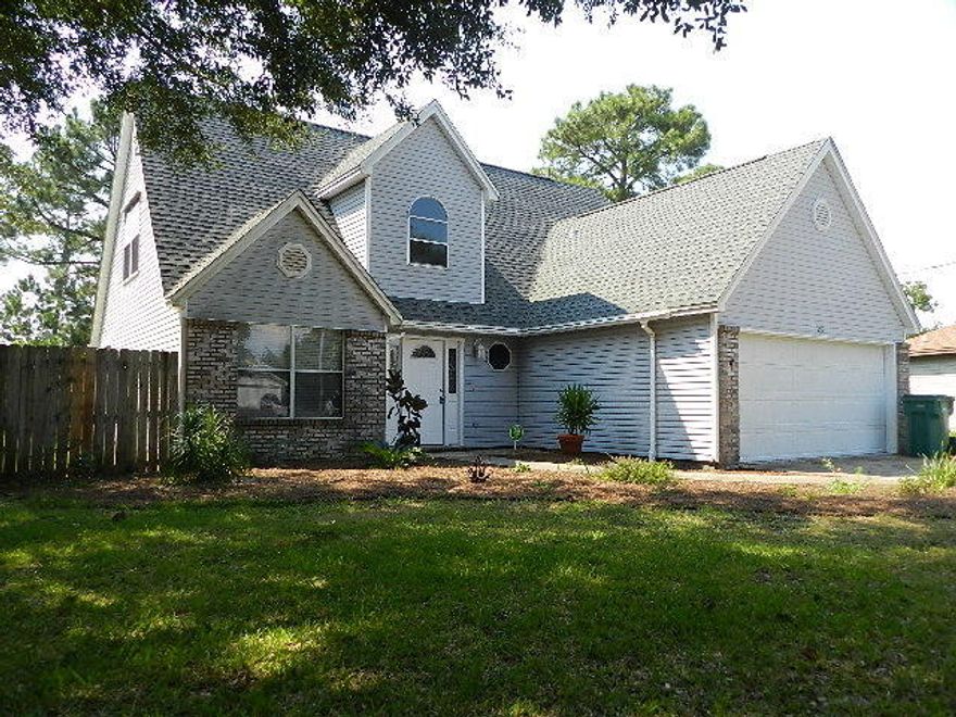 Spacious 4 bedroom 2.5 bath minutes from Hurlburt Field's main gate. Tiled throughout the living space downstairs, vaulted ceilings that give an open and airy feel. The Master bedroom is downstairs, 3 additional bedrooms upstairs. The kitchen is open to the living room and breakfast nook with access to a formal dining room. A functional floor plan in a great location at a great price!