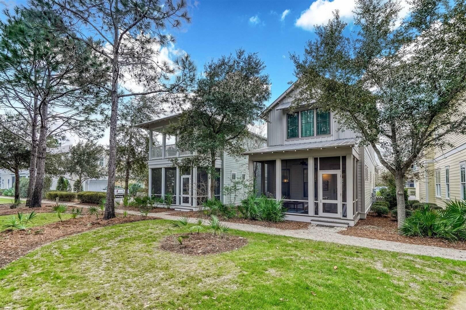 Nestled right next to Dragonfly Park, this WaterColor residence, comprising 3 bedrooms and 3.5 baths, presents a delightful pathway from its front porch to the adjacent Dragonfly Pool, a mere 100 yards away. Inside, the home radiates charm and is meticulously cared for, showcasing tasteful furnishings. Elegant hardwood floors grace the living spaces and bedrooms, complemented by natural stone tile in each bathroom.The well-designed kitchen provides scenic views of the dining and living areas, extending to a generous screened porch with a captivating vista of the park. Special features include a wet bar complete with a built-in refrigerator, extra storage space, and an all-encompassing whole-home sound system.