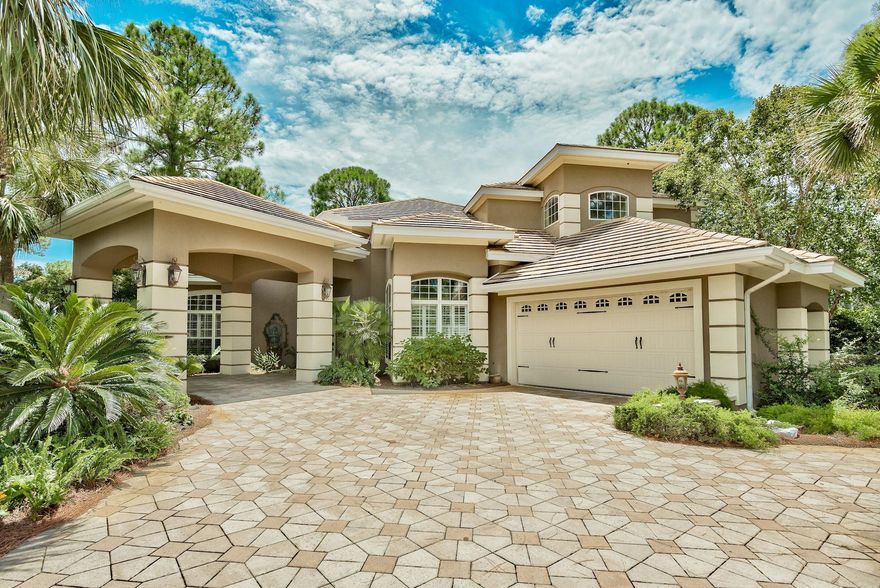 Beautifully updated home, paired perfectly with a lake side setting in the prestigious Burnt Pine community. Gorgeous views of the golf course and lake are abundant from the backyard oasis. An entertainer's dream both inside and out. Custom pool design allows walk out access from the master suite and is complemented with a swim up bar. For those cooler winter months, one will enjoy the attached hot tub as well as the pergola area with outdoor fireplace. There's also an outdoor kitchen for cookouts. Upon entry to the home you will find a spacious living/dining/wet bar combination that flows perfectly into the updated kitchen and contiguous living space. DCS appliances include a 6 burner stove, wall oven, warmer oven and microwave. Quartz countertops round off the finishes along with a