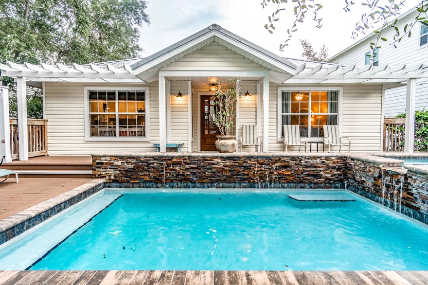 This exquisite Florida Cottage is beautifully situated overlooking the lake with also a Gulf view. The pool is located in the front of home with a wooden deck. The main level features the large kitchen with granite counter tops, lots of cabinet space and a breakfast area. Off of the kitchen is a spacious dining area. The family room is on the next level which is open to the dining area below. Many windows throughout the the home adds a lot of natural light to the cottage. There is a large deck off of the living area that is screened in, allowing you to dine out on the porch or lounge while overlooking the lake and a view of the Gulf. The newly remodeled Master bedroom and bath, is located a few steps below the living and dining area. So much more, so come see it! You will love it!