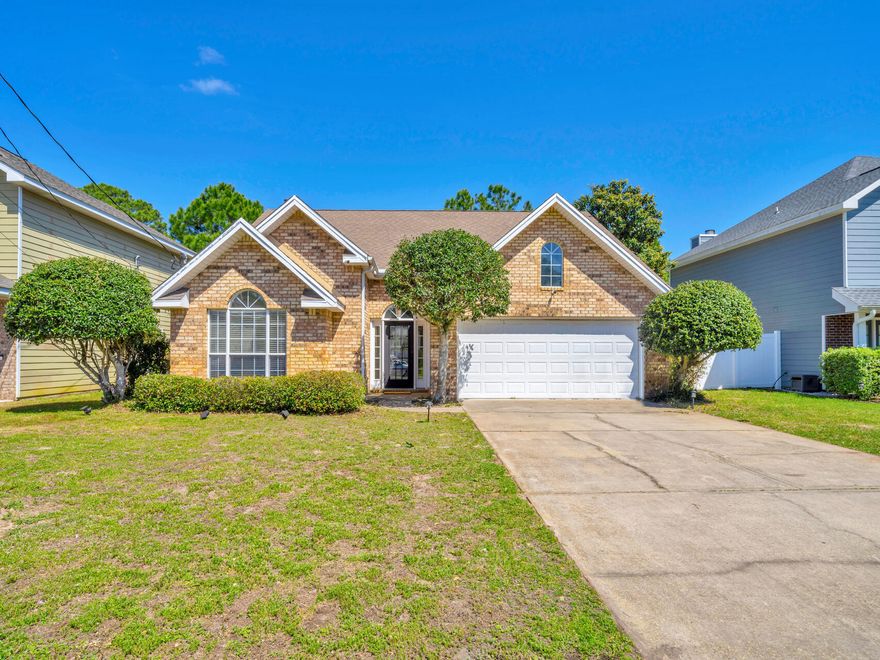 Discover the perfect blend of charm and convenience in this 3-bed, 2-bath home with a desirable split floor plan - perfect for everyday living or coastal getaways. The open-concept living area features a welcoming fireplace, while the kitchen shines with a large island and stainless steel appliances. The primary suite offers a relaxing retreat with tray ceilings, a walk-in closet, and a spacious bath with separate tub and shower. Ideally located between Destin and Sandestin, you'll love the easy access to white-sand beaches, golf courses, and local hotspots.
