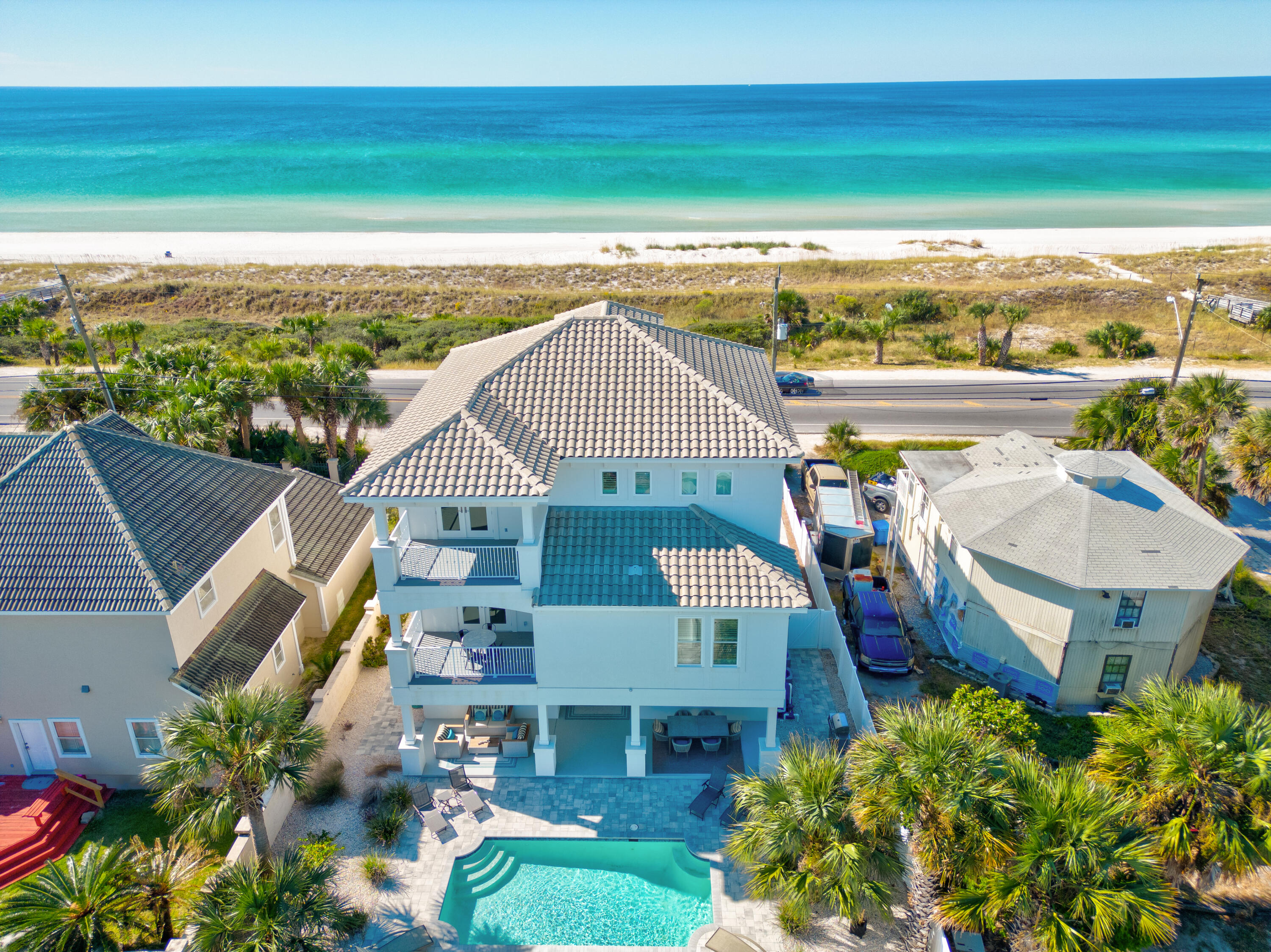 Looking for an unobstructed Gulf View, this is it...Introducing 14208 Front Beach Road, an exceptional coastal estate that perfectly captures the essence of beachfront luxury. Situated in the highly desirable Bid-a-wee Beach neighborhood of Panama City Beach, this stunning residence offers an unmatched combination of modern elegance, thoughtful design, and panoramic Gulf-front views. This five-bedroom, five-and-a-half-bathroom retreat spans an impressive 3,897 square feet, blending spaciousness with sophistication. From the moment you step through the main door, you're greeted by a sun-drenched interior where floor-to-ceiling windows frame the sparkling turquoise waters and pristine white sands. The open floor plan seamlessly connects the main living areas, creating an inviting space idea The open floor plan seamlessly connects the main living areas, creating an inviting space ideal for both relaxation and entertaining. At the heart of the home lies a chef's dream kitchen, equipped with top-tier appliances, custom cabinetry, and sleek stone countertops. A generously sized island provides a central hub for gathering, while the adjacent dining and living areas offer a refined yet comfortable ambiance, all with uninterrupted views of the Gulf as your backdrop. This living room offers a fireplace on top of a great entertainment system. The primary suite is a private haven, featuring breathtaking water views and direct access to an outdoor balcony. Its spa-inspired bathroom is designed for indulgence, boasting a soaking tub, glass-enclosed shower, dual vanities, and premium finishes. Private seating area with a fireplace and entertainment system. Each additional bedroom is thoughtfully designed, offering its own ensuite bathroom to provide the ultimate in privacy and comfort for family or guests. Step outside to experience the pinnacle of beachfront living. Multiple outdoor terraces and spacious patios offer the perfect setting for al fresco dining, lounging under the sun, swimming in the inground pool or hosting evening gatherings with the serene sound of waves as your soundtrack. Private access to the beach ensures that the Gulf's pristine shoreline is always just steps away. Conveniently located, this exceptional home is moments from some of the area's best dining, shopping, and entertainment options, yet remains a tranquil oasis where you can fully embrace the coastal lifestyle. Please do not let this gem passes you by, make a showing appointment to view this exceptional piece of paradise.