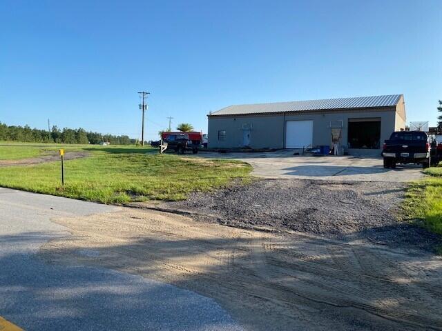 Zoned HEAVY INDUSTRIAL!! Huge income potential. Great location. Minutes from I-10. Minutes from the beach. The largest property around with this zoning. Two driveways. 2 offices, 2 stories, 2 bathrooms, 2 bay doors, 1 loading dock. Half the property is still wooded. The turn lane for 331 and Edgewood is in front of the property for easy access.
