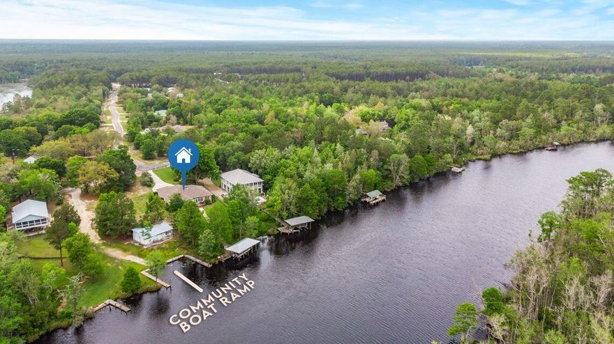 Absolutely stunning, WATERFRONT, brick home on .6 acres in booming Freeport! This home has been beautifully updated to include stainless steel appliances in the kitchen, beautiful white cabinets, and newer engineered quartz countertops and luxury plantation shutters for that special coastal look! The split floor plan and two living areas really make this home special! Enjoy your morning coffee in the spacious sunroom or on your dock with DEEP water bay access all year round. 15 min to Choctawhatchee Bay!! A short walk out to your dock and you're out on the bay, restaurants or the popular crab island! The remote controlled boat lift holds a whopping 10,000 pounds or take advantage of the community boat launch right next to you. Schedule your showing before this beautiful home is gone!