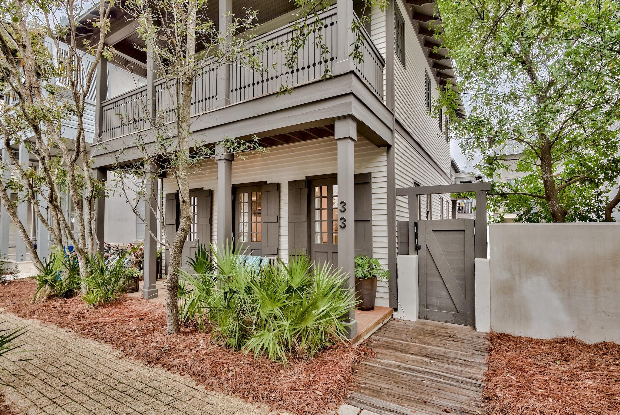 Beautifully remodeled Rosemary Beach cottage with private pool and carriage house. The main house greets you with an open floorpan concept that combines the living, dining, and kitchen areas. Warm up on cooler days with both an indoor and outdoor fireplace. The main level also has a half bath that connects to an outdoor shower for convenience after a day at the beach or pool. Tile flooring throughout the first floor and refinished oak floors on the 2nd level. The second level contains a bunk area in the hall along with 2 bedrooms and 2 baths. The master suite also has a rocking chair porch for relaxation. All baths and kitchen have been updated for today's discerning buyer. Connecting the main house and carriage is a stunning courtyard with private pool and outdoor fireplace. The