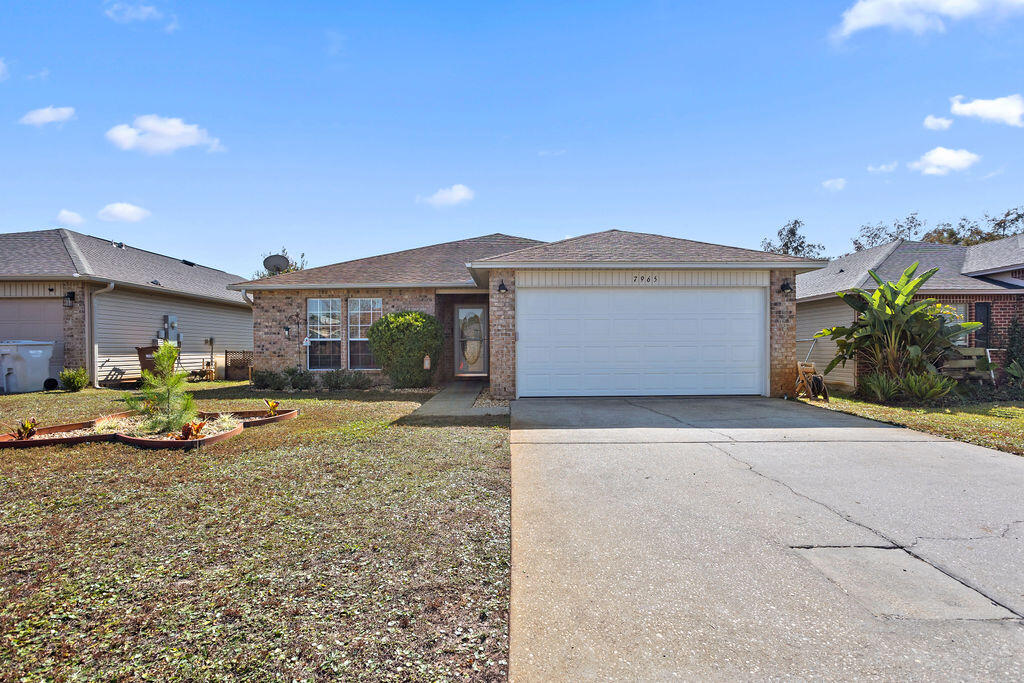 Very well-kept cozy home at Promise Creek in west Navarre.  This 3 bed, 2 bath house has just over 1600 square feet of open living space with features such as laminate floors throughout, tall ceilings and a sitting room off the primary bedroom.  The back yard is accessed via the Florida room for extra living space.  This home is also within walking distance to Holley-Navarre Middle and Primary School.  Please consider this house for your next home.