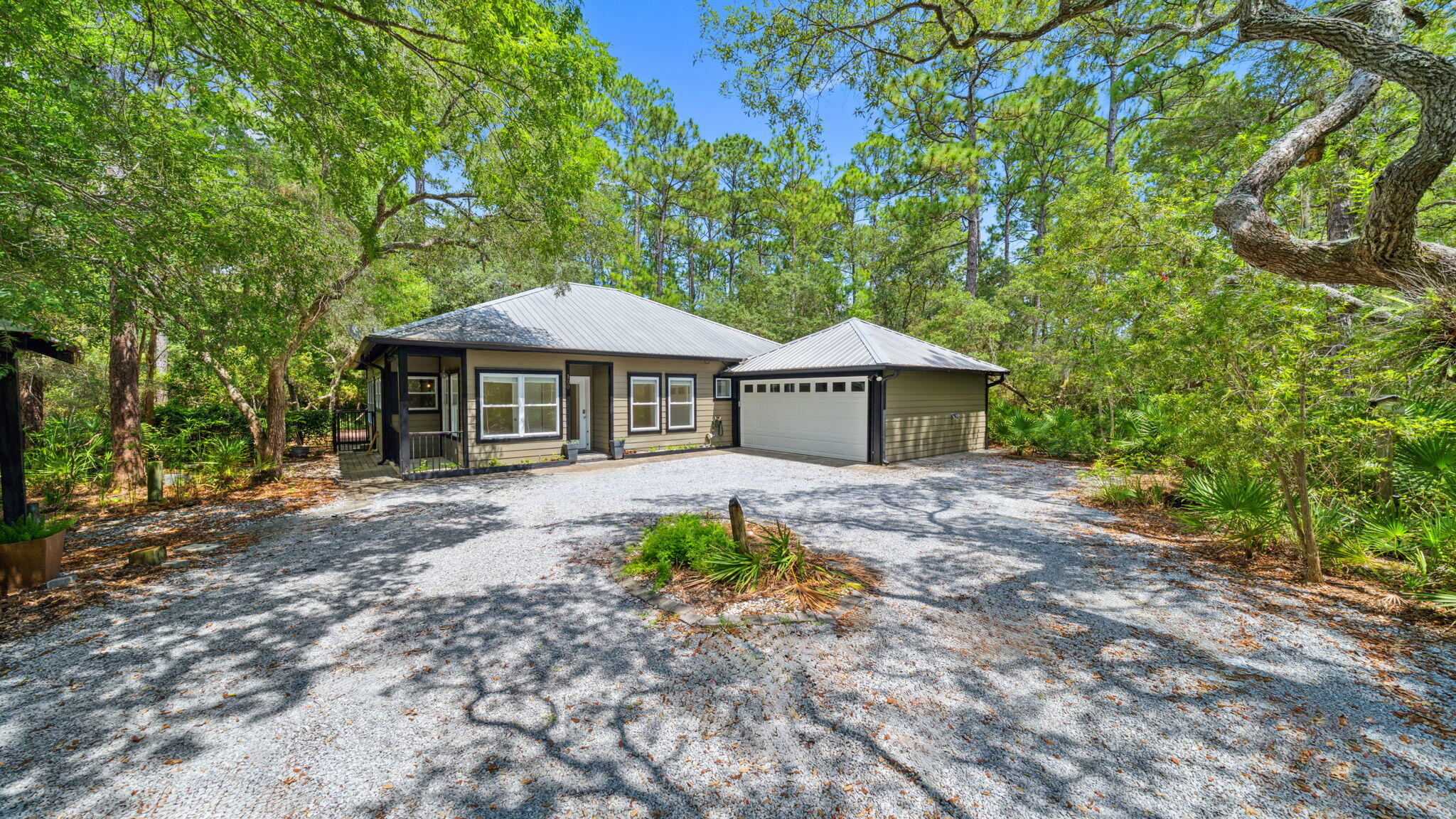 Nestled on a generous 0.64-acre lot in the heart of Point Washington, this charming 3 bed, 2 bath coastal cottage offers the perfect blend of natural beauty and convenience. Located just five minutes from Grayton Beach and Scenic 30A, and a 1.7 mile walk to Bayside Ranchettes Park for bay access, shaded parking, picnic table, dock for fishing, and a kayak/canoe launch.As you enter the property, a winding driveway shaded by towering oaks and pines sets the tone for the tranquil lifestyle this home provides. The natural landscape creates a private retreat, making it easy to forget how close you are to the restaurants, shops, and beaches of 30A. Inside, the open floor plan offers a comfortable, low-maintenance layout. An abundance of windows throughout the home invite in natural light and views of the surrounding forest. Spacious kitchen with a large breakfast bar overlooks the dining area. From the dining area, you have direct access to the enclosed patio. There is also an office space that can be converted into a workout room or playroom.
Step outside to the spacious screened-in porch, where you can unwind with the sounds of nature, spot an occasional deer, and listen to birdsong. This peaceful outdoor living space is ideal for morning coffee or winding down in the evenings.
At the end of the street, the bay awaits. Take a short stroll to catch a sunset, watch mullet leap from the water, or see an osprey swoop across the sky, moments that remind you just how special this location is.
If you're seeking privacy, nature, and proximity to 30A without the crowds, this is your opportunity. Schedule a showing and experience the serenity of Ivy Lane for yourself.