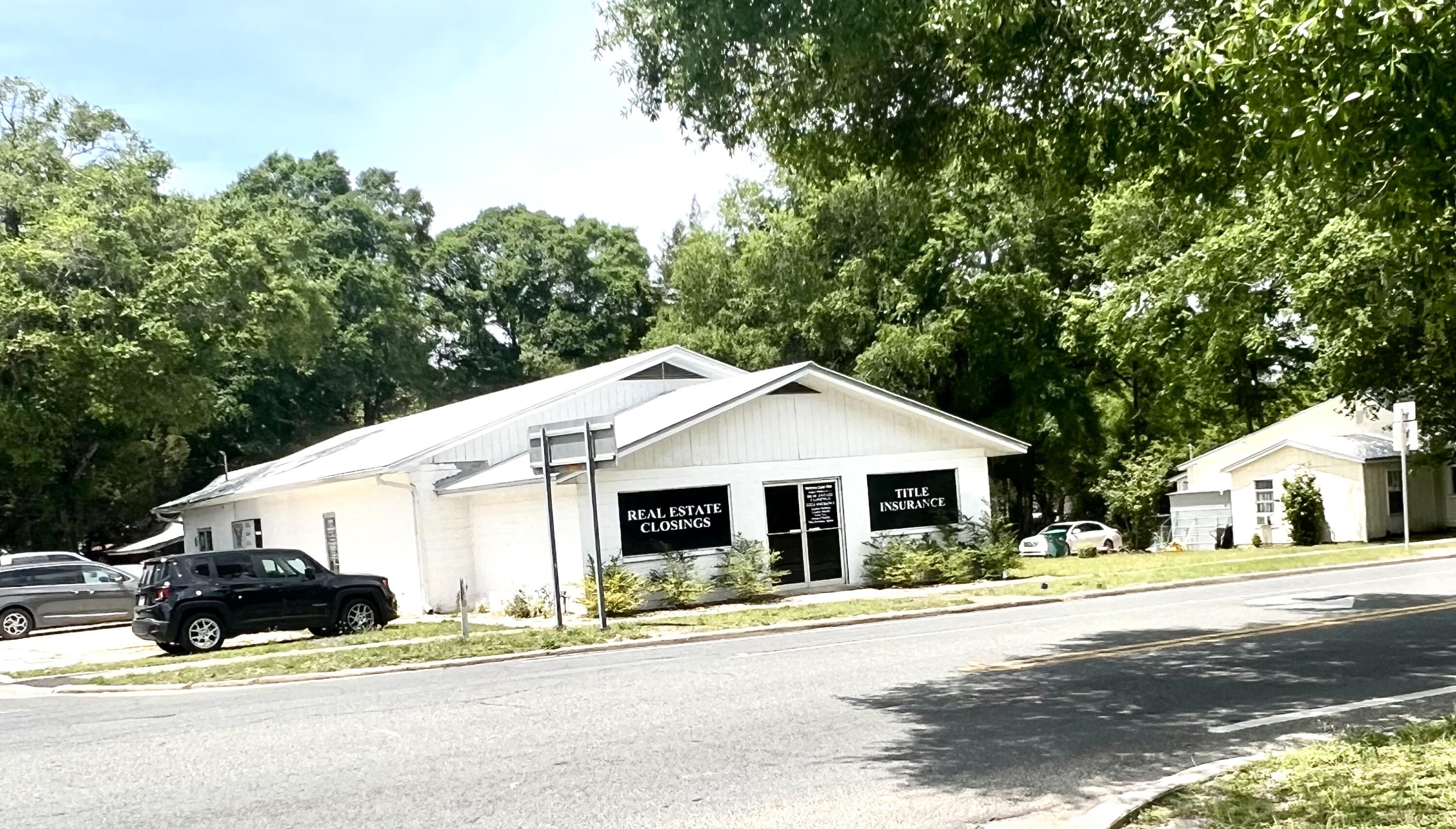 Perfect Commercial Location! This 3344 s.f. block building with silver metal roof has the possibility of 3 rental units within, or you can use the entire building for your business. It has 3 phase electric at the pole if needed. City water and sewer. Separate heat pumps to each unit. Floor plan is suitable for a doctor's office, business office, lab, plenty of plumbing in place for a nail shop or spa. Includes a full kitchen with dishwasher and stackable washer/dryer room, 3 bathrooms, file room, 10+ office spaces, 2 conference areas that could be used as triage area for a doctor or lab. Average daily traffic is 9,500 vehicles. Centrally located to the town, just 1 block over from Nelson Ave (Hwy 90) and the Historical area-DeFuniak Springs, FL. Great visibility!