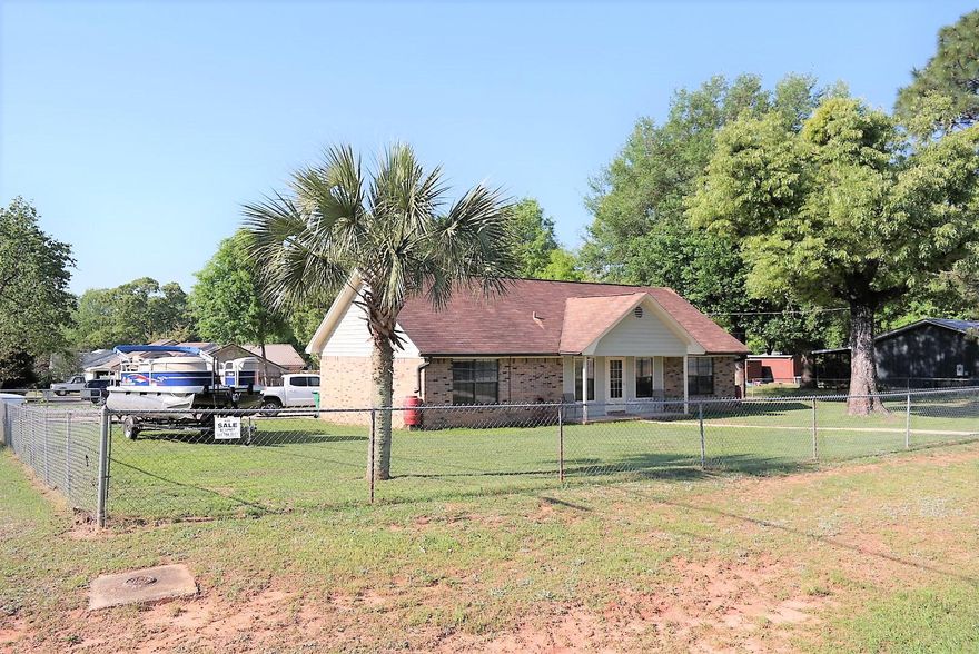 You'll definately want to put this one on your must see list! Immaculate brick home on almost 1/2 acre corner lot (completely fenced), electronic gate, garden, workshop, screened patio, security system and more! Interior features include real wood floors in living room and kitchen; tile in baths and carpet in the bedrooms. Seller is having new roof installed, to be completed prior to close! Hot tub stays with full price offer! Smaller shed does not convey. Schedule your showing today!