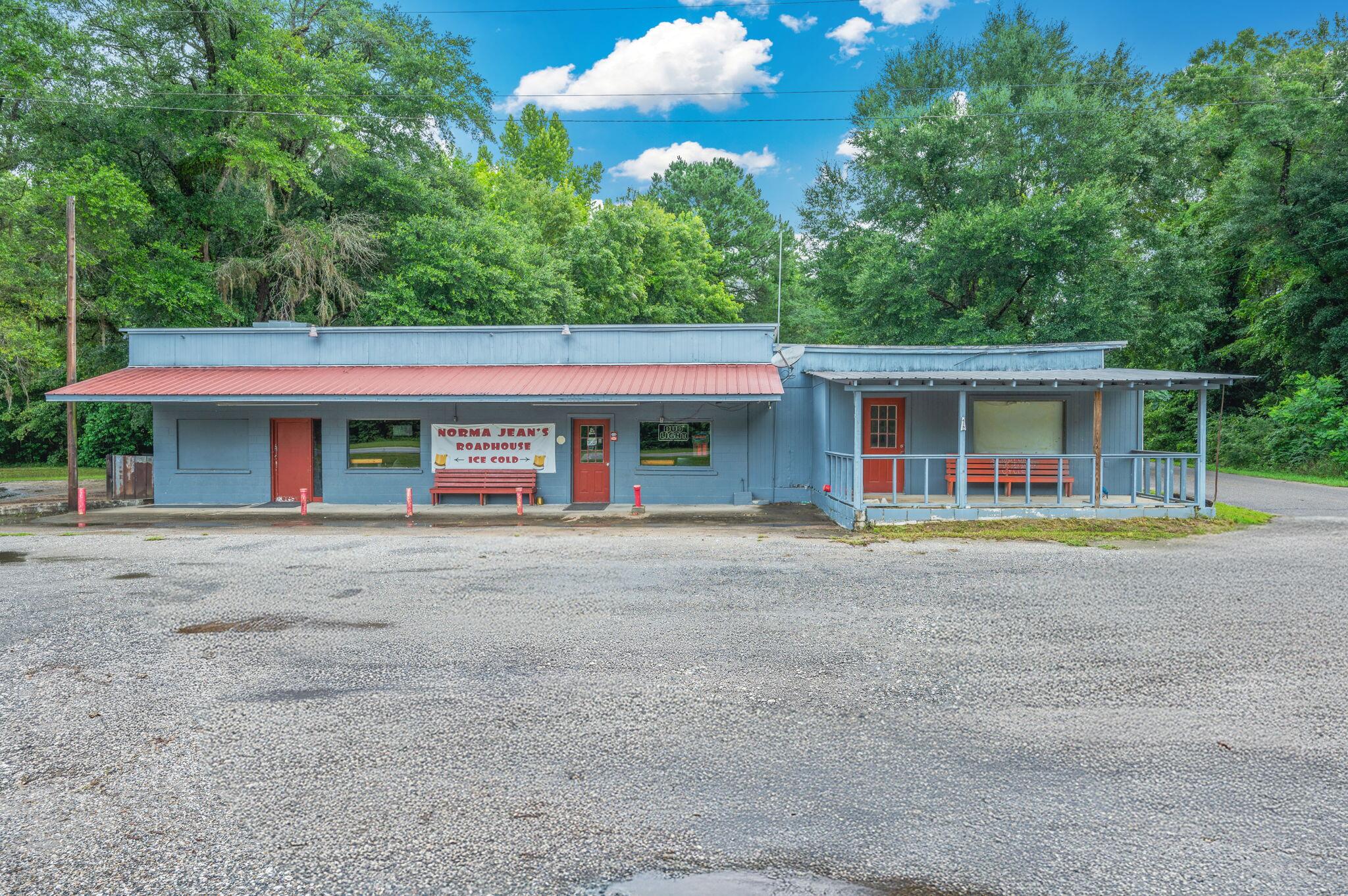 Live, Laugh, Lounge. Your Business Dream Starts Here with +/- 90ft of US Hwy 90 frontage! Ready to pour up profits and crank up the fun? This 2,103 sq ft commercial gem on .37 acre is more than a building, it's a full blown good time headquarters, waiting for its next owner to make a splash in the nightlife or entertainment scene. Step inside to find a spacious L-shaped bar outfitted with triple and double coolers, multiple sinks, and plenty of elbow room for slinging drinks and making friends. There's even a serving window to the 28' x 24' patio, perfect for outdoor vibes and sunset sips. Got talent? Showcase it! With a karaoke stage, live music stage, and DJ booth, this place is set for entertainment. Add in the pool tables, tables and stools, and you've got all the ingredients for a crowd-pleaser. Two bathrooms, a dedicated storage room, 12 X 24 storage shed, and even an RV hookup out back for your food truck, road-tripping talent, or weekend warrior friends. The best part? It's turnkey, just unlock the doors, set up your equipment & your playlist, and watch your business come to life.Cheers to your next adventure. The stage (and keys) are waiting!
And if bar life isn't your thing, don't worry, this versatile space offers plenty of other commercial opportunities. Let your imagination run wild!