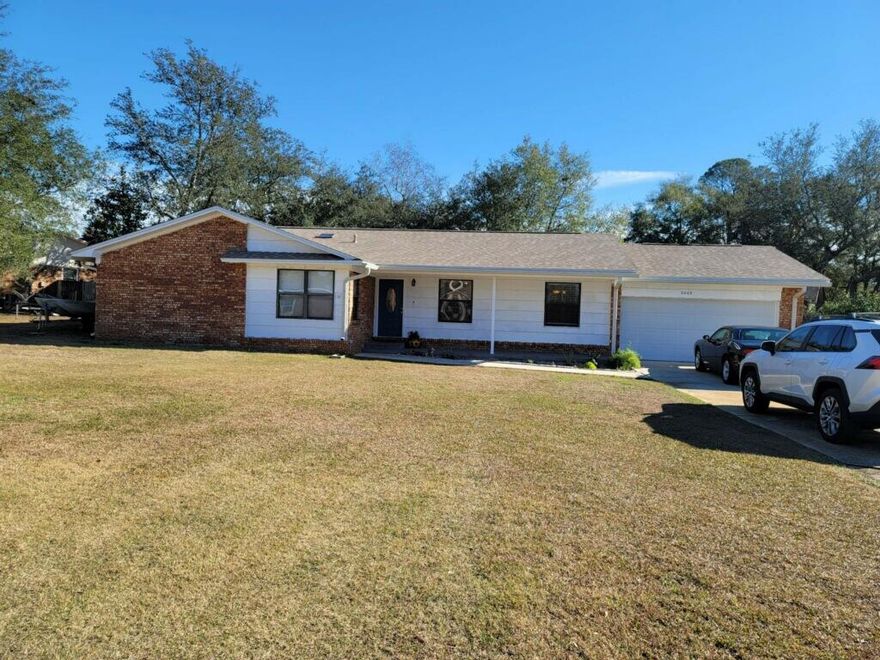 Enjoy INDOOR and OUTDOOR living at it's best! This open, flowing, four bedroom two bath home has a large yard and wide front porch.  NEW ROOF just installed in Dec. 2019!  Inside, the living area flows beautifully from space to space into the dining room and kitchen. The updated kitchen offers granite counter tops, stainless appliances, real wood cabinetry, and a pantry. Updated flooring and fireplace. A large screened heated salt water pool in the back of the fenced yard. New leaf filter gutter guards, Newly added outdoor stone patio and grill area with a fire pit lends to fabulous entertaining!
