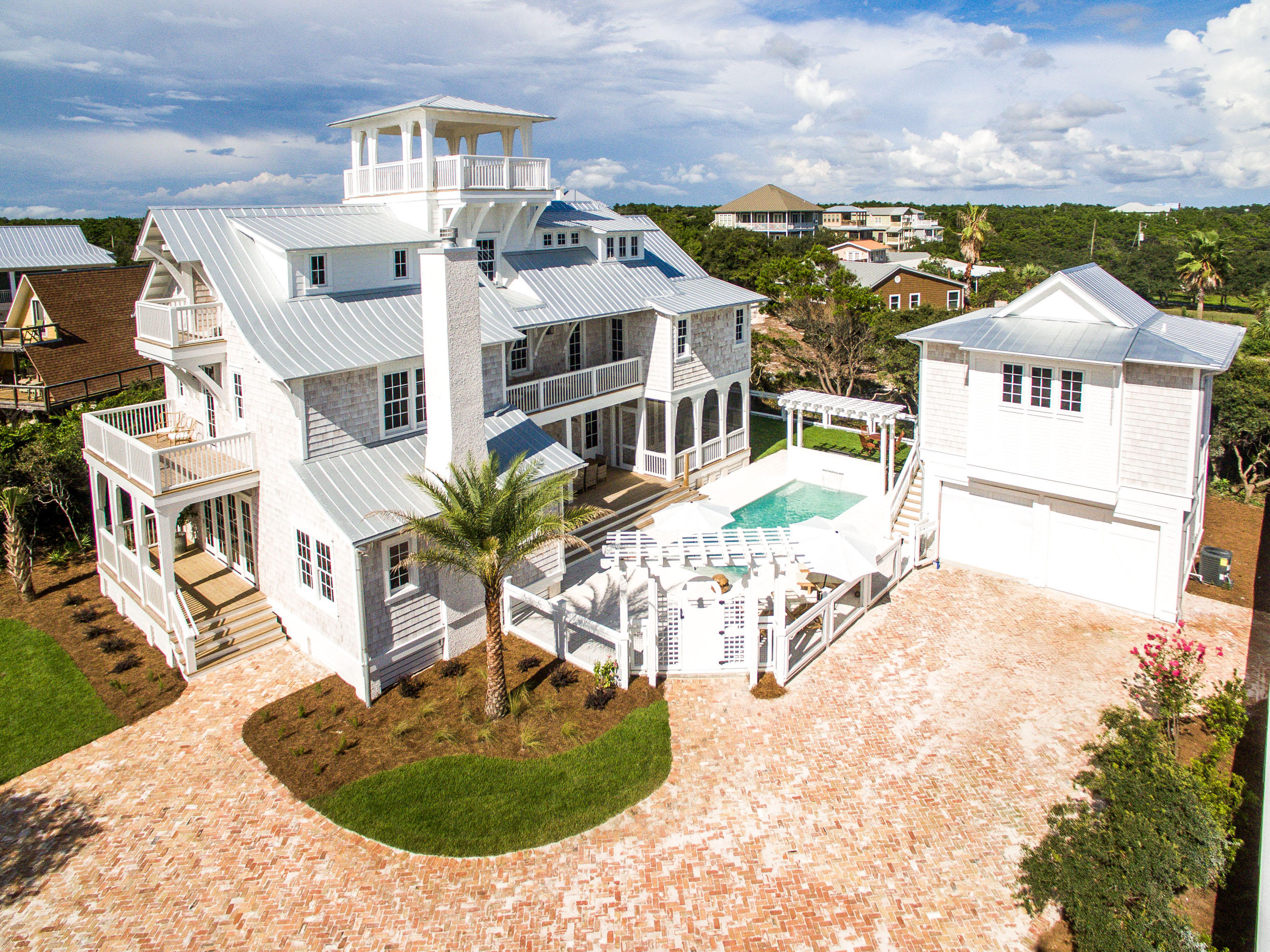 A fabulous, fully furnished, cape cod style, legacy home located in 30A's hottest area, the original Inlet Beach. This home is located on one of the largest, most private lots remaining in this neighborhood, with close and easy access to the Gulf of Mexico. Quiet and private with no traffic to deal with, yet right in the heart of the Rosemary Beach/30Avenue triangle! Enjoy an easy walk to all the shops, restaurants and entertainment this area offers, while enjoying privacy, plentiful on-site parking and ease of access to Hwy. 98 that is becoming so vital as the area blossoms. This home offers spectacular 180 degree gulf views, a large private pool, outdoor kitchen, elevator, carriage house, and all the luxurious, high end finishes that are expected in a Legacy Home of this quality.