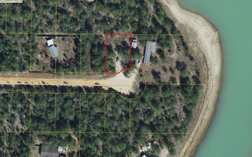 Partially cleared lot for building your home or placing a manufactured home in Mossy Head. There was a mobile home here in the past, however buyer to verify utility connections and septic tank. Agent has ownership interest in property.