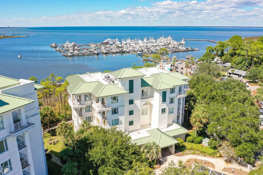 This gorgeous bay front, corner unit at the exclusive gated complex of Anchorage at Sandestin offers spectacular views of the bay as well as the Baytowne Marina! It offers an open floor plan with lots of natural light and a huge covered porch overlooking the bay. 3 bedrooms and 3 full baths, 2057 square feet, tile throughout, handicap accessible custom master bathroom, electric shades, and a PRIVATE GARAGE are just a few of the features of this luxury property. There's plenty of guest parking spaces as well as golf cart parking. Anchorage at Sandestin is a gated community within behind the gates of the Sandestin Golf and Beach Resort. Anchorage offers a private pool for it's owners and guests (no short term rentals are allowed) and it's just steps to the Baytowne Marina, The Marina Bar and