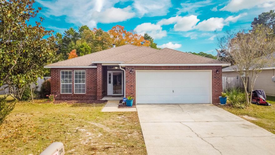Come see this beautiful, corner lot home in Navarre just 4 miles away from the beach! Located in the Promise Creek neighborhood, this property sits on a 0.165 acre corner lot & features a large, fenced backyard space with a covered porch & firepit area. The interior showcases an open floor plan with vaulted ceilings in the spacious living area that also has a fireplace, along with a kitchen that overlooks the living & dining areas and includes a breakfast bar, lots of counter space, & a pantry. The main bedroom suite is separate from the other bedrooms & the bathroom features a walk-in closet, a double vanity, & a garden tub. The property is located within 2 miles of Publix Supermarket and other restaurants & shopping off of US-98, along with being within 4 miles of Navarre Beach.