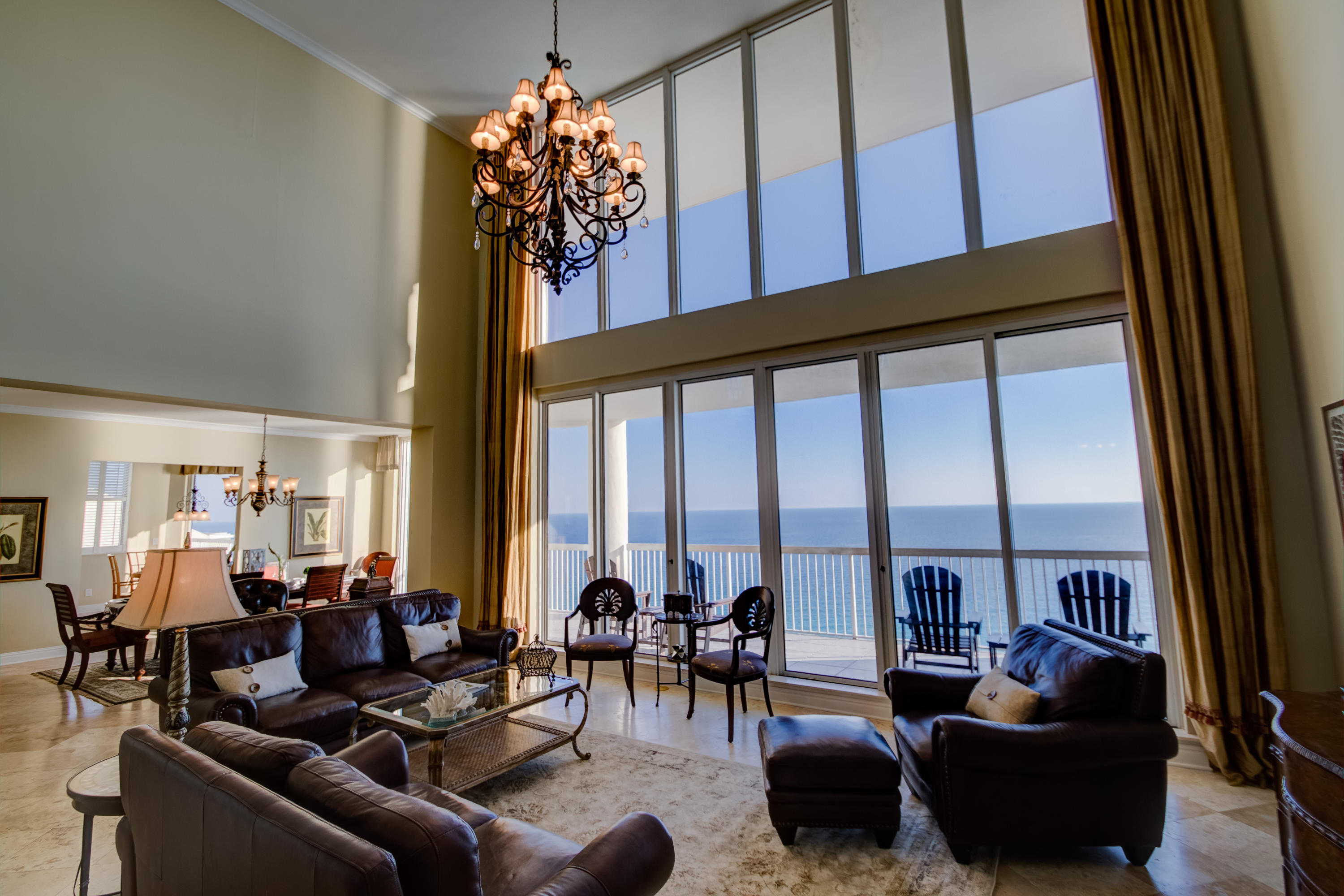 Uniquely rare penthouse end unit in Silver Beach's East Tower with private 2-car garage and gulf views from nearly every room! On the first floor, enter to witness unbeatable gulf views through floor-to-ceiling windows in the two-story great room, lit by a grand chandelier. The large open kitchen is situated between the breakfast nook and a second, more intimate, living area. A formal dining area, two bedrooms with baths, a powder bath, and a wet bar round out the 1st floor. Upstairs, the luxurious master wing boasts a large bedroom, walk-in closet, private study, and a lavish bath overlooking the eastern coastline with oversized Jacuzzi tub, separate shower, and double sink vanity. Two more bedrooms with baths and a laundry room with exterior access finish this magnificent luxury retreat.