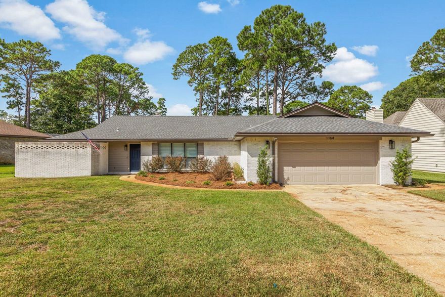 Fully updated modern home located in desirable Bluewater Bay. This 3bd/2ba home sits on a large lot and backs up to the 12th hole of the Bluewater golf course. Limewash brick brings curb appeal and compliments the large windows and modern fixtures that adorn the outside. An aesthetic open concept living space greets you as you enter this home with inviting LVP floors, whitewashed fireplace, LED lighting, and views of the golf course. A kitchen made for entertaining opens to the main space with a breakfast bar, clean bright counters, soft close cabinets and drawers, contemporary appliances, and a large apron sink. Bedrooms feature oversized windows that highlight the current and considerable updates of this beautiful home. The primary and secondary baths lend coastal luxury with shiplap accents, and complimentary paint colors. A large, enclosed Florida room allows for additional entertaining space, or quiet mornings sipping coffee. Call for your showing today!!