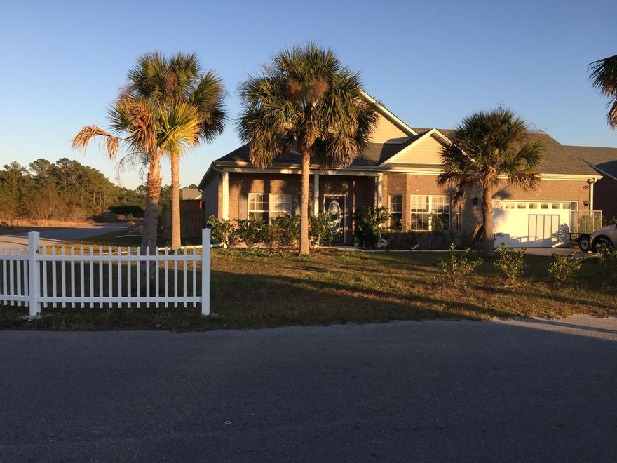 Fantastic home in this desirable location just off Hwy 331 near the new Publix Shopping area and expanded Hwy 331 Bridge. Minutes from the state parks and the white sand beaches of 30A. Corner lot with large fenced yard. Fence features 10Ft swing gate for easy access to backyard. Fabulous large patio for entertaining. Storage building in yard and workbench constructed inside oversized garage.Neutral paint, tile and carpet throughout. Dark cabinets in kitchen, stainless appliances and black granite countertops. All appliances convey including microwave, washer, dryer and refrigerator. This one will go fast!