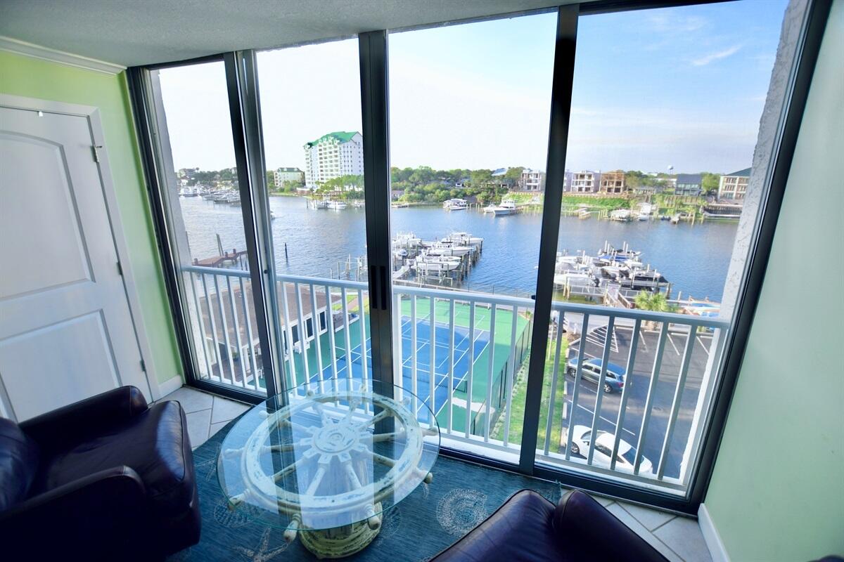 VERY MOTIVATED SELLER!! Dolphin Point harbor front condo is ready NOW. Fully furnished, new ventless washer/dryer, new hurricane-shutters on windows and sliding glass doors, prime 6th floor corner, additional living space created by the heated/cooled enclosed balcony. Simply open the sliding glass doors and enjoy the outside. Two full bedrooms and a bunk room (sleeps six), plus two full baths. The master bedroom faces the Harbor. The kitchen features beautiful cabinets, stainless appliances and granite countertop. Dolphin Point is a private community that features harbor side pool, deeded beach access a short walk away, exercise room, tennis/pickleball court, exterior storage for condos, private waterfront clubhouse, three outdoor grill/picnic areas, marina, paddleboard/kayak launch, and beautiful landscaping. Destin Water Taxi can pick you up at the dock for transportation to the multitude of restaurants/bars, shopping and entertainment on the Harbor...and then bring you back! VA Approved for any Military Buyers! Many community upgrades are currently underway! Perfect residence, second home or rental property.