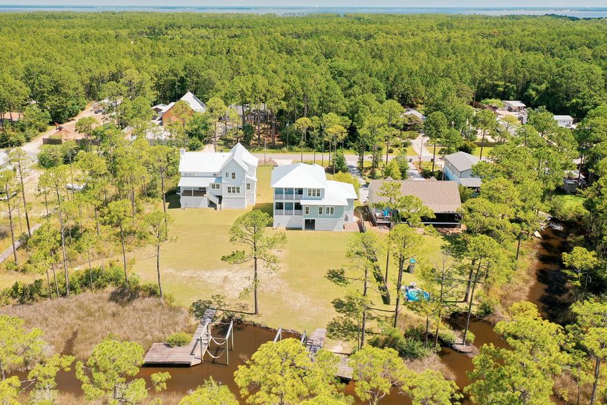 Welcome to a rare opportunity to own a remarkable waterfront estate in Santa Rosa Beach--two newly constructed homes sitting side by side at 109 and 121 W Nursery Road, offering an unmatched blend of luxury, location, and lifestyle. Positioned on large adjoining lots with private docks and boat lifts, these homes are perfect for multigenerational living, extended family, or those seeking investment potential.As you step into either residence you are greeted with expansive windows framing sweeping water views. Both homes feature open-concept floor plans centered around an inviting living spaces that seamlessly flow into the gourmet kitchens and out onto covered balconies--ideal for year around entertaining. The outdoor living is elevated with warm wood ceiling details and modern cable railings to preserve the view. Whether hosting guests or enjoying a peaceful sunset, the waterfront ambiance is ever-present.

The primary suites in each home are thoughtfully located on the main level, offering private waterfront views and spa-like ensuite baths complete with dual vanities, deep soaking tubs, large walk-in showers with floor-to-ceiling tile and gold-accented glass enclosures, and custom walk-in closets with wood shelving. Additional main-floor guest bedrooms include full ensuitesideal for comfort and convenience.

Upstairs, both properties include additional guest bedrooms with private ensuites, plus flexible bonus rooms perfect for home offices, playrooms, or media spaces. One home even includes a third floor, offering additional living potential with iron-detailed staircases adding a touch of architectural sophistication.

The generous lots offer endless potentialadd a pool, putting green, or create your own outdoor oasis individually or to share amongst family or friends. With direct access to the bay, you can take the boat out for a full day on the water or enjoy a sunset cruise after a day of work.

Located just minutes from iconic 30A and 10 minutes to Sandestin, you'll have easy access to local dining, boutique shopping, live music, and year-round festivalsnot to mention the pristine white-sand beaches the Emerald Coast is known for.