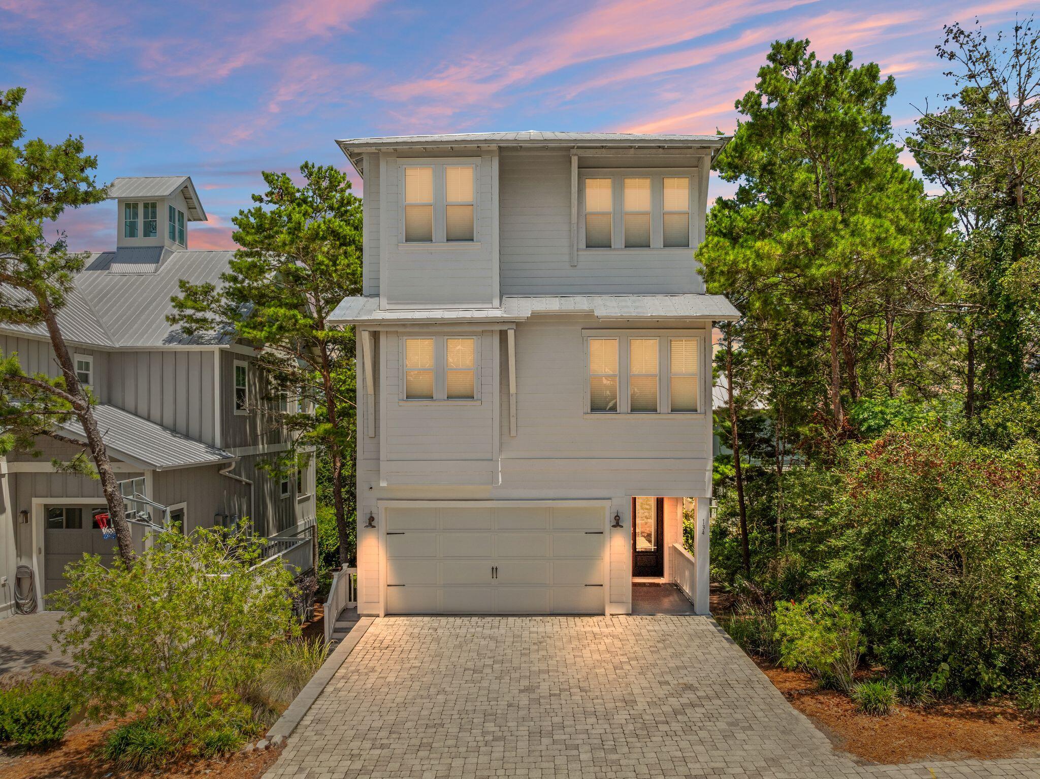 Welcome to Grande Pointe, a charming and quiet community tucked away in the sought after South Walton area. This spacious 4-bedroom home offers elevated coastal living with 10-foot ceilings and a large living entertaining area. Upgraded kitchen including gas stove & hood range. Large master suite on the 3rd floor. ELEVATOR for ease of accessing 2nd & 3rd floor. Grande Pointe is situated perfectly in Inlet Beach stretching the length between the entrance off Highway 98 all the way to the community dock on Lake Powell boarding Camp Helen State Park. Enjoy direct access to Lake Powell, Camp Helen. The family can enjoy the huge lake front community pool. All this while just steps away from the beaches of South Walton or a quick bike ride under the tunnel to access Scenic Highway 30A.