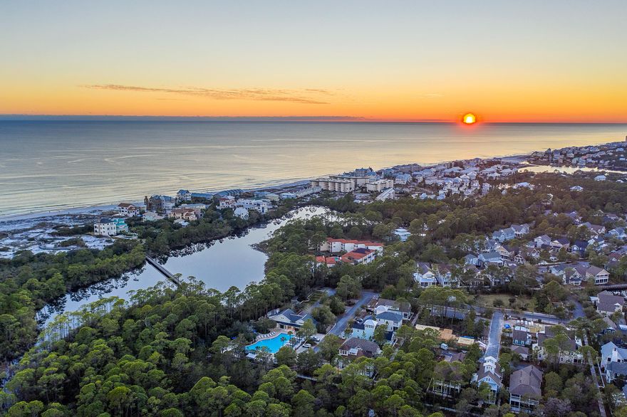 Situated on the most elite homesite in Watersound West Beach, 395 Tumblehome Way is bordered by vast natural state park offering the utmost privacy. Located adjacent to the beach walk-over and community pool, this property offers premier access to the amenities, natural resources, and the sugar white sands of the emerald coast beaches. This custom craftsman home features true wide planked hardwood flooring, wood beam-work and luxury appliances as well as hand-selected fixtures, lighting and tile. Offered fully furnished, the well-thought-through floorplan showcases an expansive open concept living space on the main level, a large master suite, 3 guest bedrooms and 3 guest bathrooms. Plenty of storage can be found throughout the every level of the home. Multiple outdoor entertaining spaces