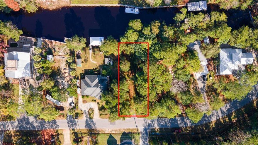 Build your dream home on this .26 acre canal front lot with access to Choctawhatchee Bay! Lot has concrete boat ramp, close to schools, beaches, restaurants and shopping.