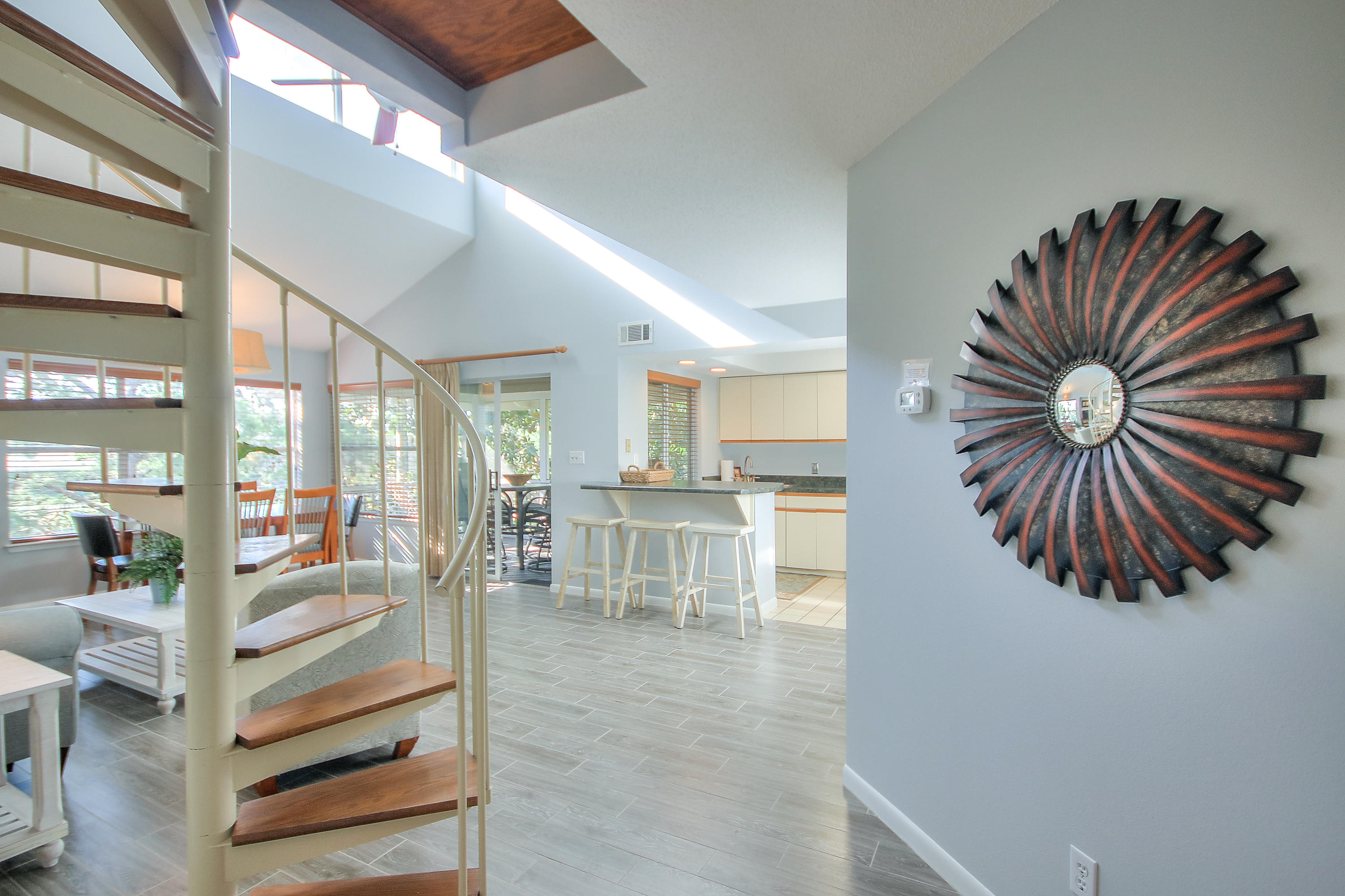 New Remodel! Great Rental $32,000 income ytd! New Wood Look tile floors, paint, living room furniture and bedding! Please note all current rental bookings must be honored. 3 bedroom 3 bath cottage with a unique ''tree house'' feeling! Community pool just steps away as well as beach Access. The views from the screened porch of the lush grounds are awesome. The condo's interior was professionally decorated with an open and functional floor plan. Special features are an open serving window from the kitchen to the porch, a seating area in the master bedroom and a loft with its own bathroom. The condo's location offers a short walk to the beach and both pools. Hidden Dunes is a beach front development that offers a tennis center of 6 rubico clay courts.t