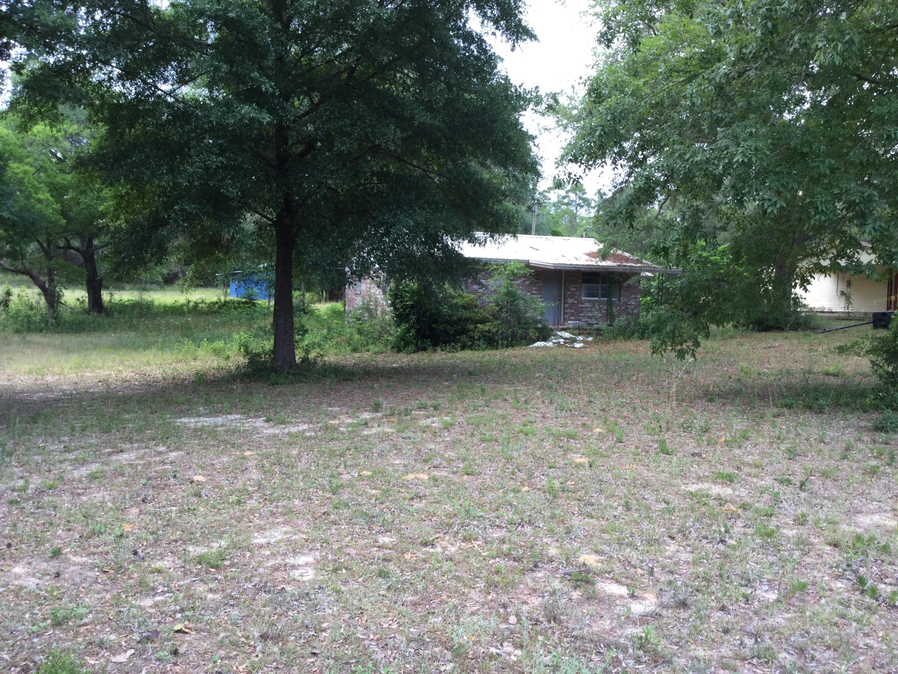 Looking for a great buy...this is your opportunity. Brick home located on 3.369 acres in Mossy Head. Home has newer metal roof and buyer will be able to finish to their desired taste. Horse lovers will fall in love with the 36x48 pole barn complete with stalls and tack room. Enjoy the Mossy Head community while being conveniently located between Crestview and DeFuniak Springs. Home is being sold as is.