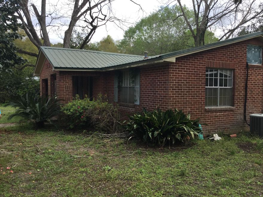 This home located approximately 2 miles to I10 that boast country charm with a beautiful yard and has mature trees including fruit trees, scupanon vines, and Catawba worm trees. The home has three bedrooms and one bathroom, an open carport and fenced backyard. *** Buyer to verify all information deemed important.